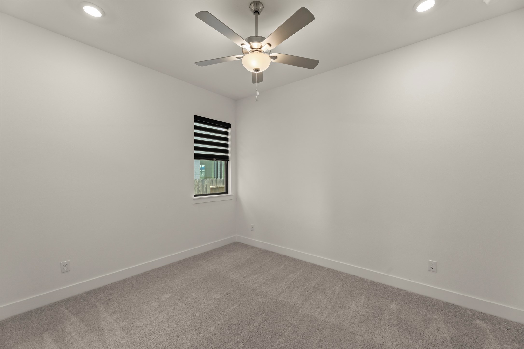 Contemporary ceiling fan, perfect for a cozy retreat or home office.