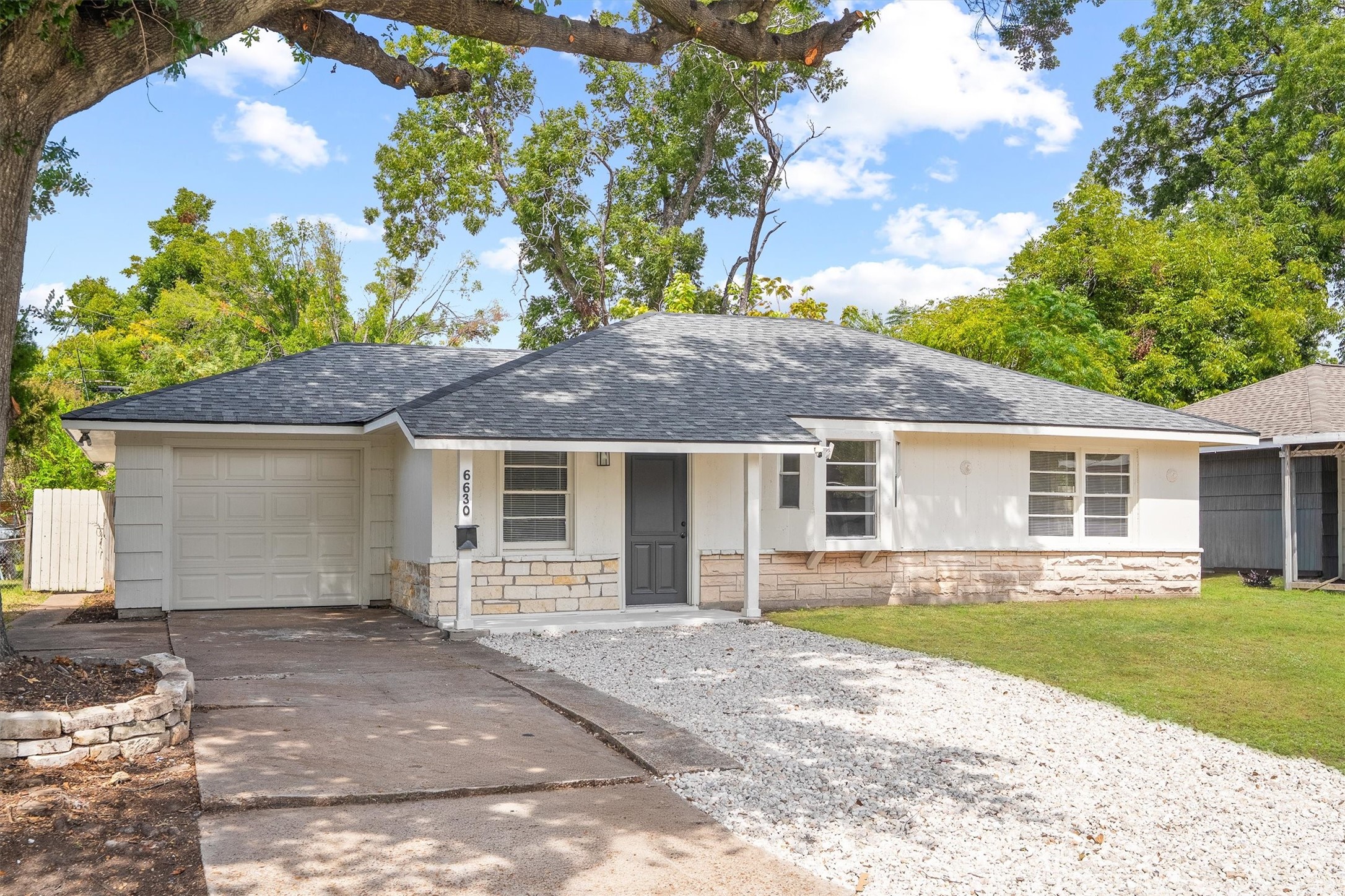 Nice single-story home with a modern roof and fresh exterior, featuring a cozy front porch and a spacious attached garage, nestled in a lush, tree-lined neighborhood. Nice single-story home with a modern roof and fresh exterior, featuring a cozy front porch and a spacious attached garage, nestled in a lush, tree-lined neighborhood.