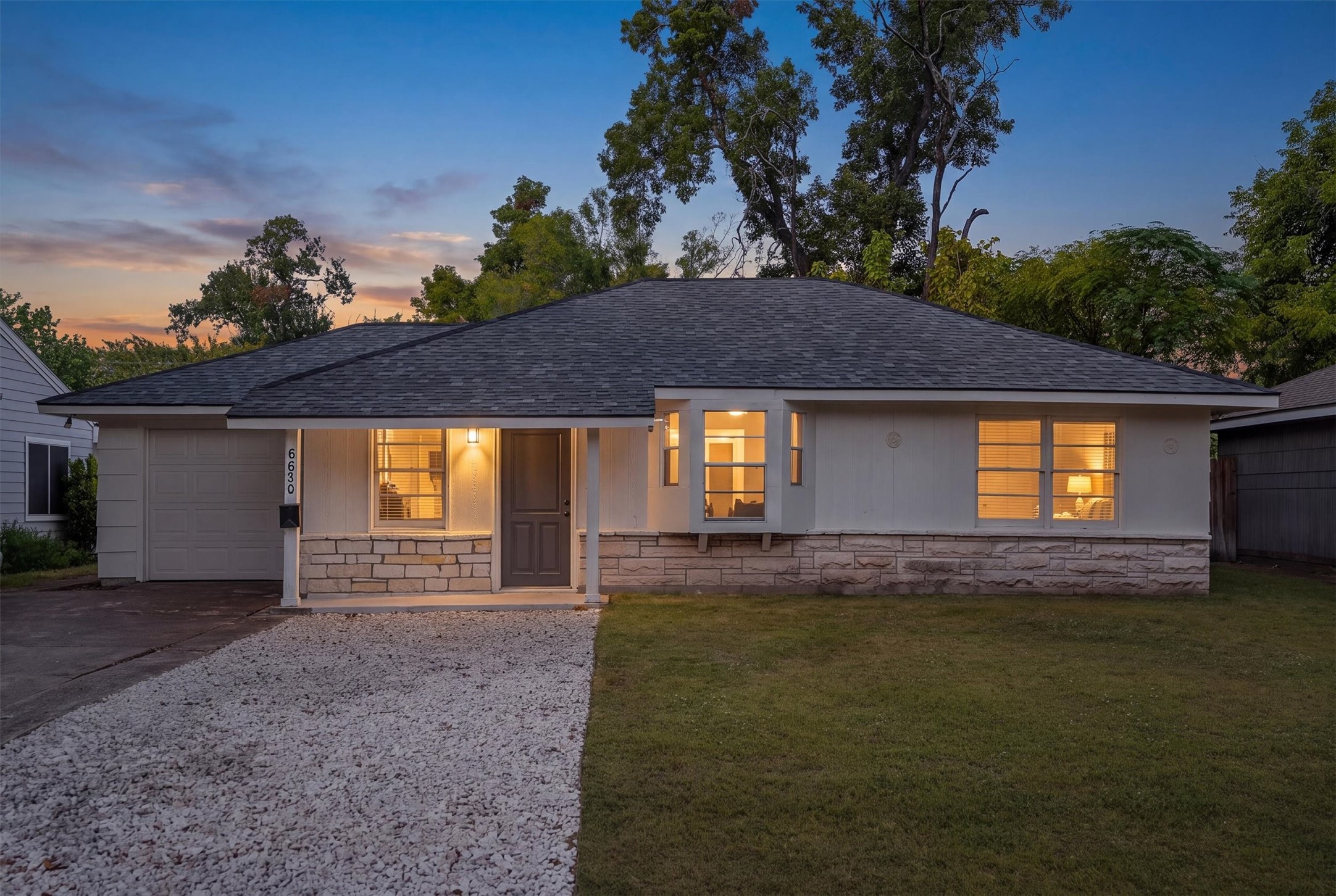 Charming single-story home with a welcoming front porch, updated lighting, and a well-maintained exterior, set against a backdrop of mature trees. Charming single-story home with a welcoming front porch, updated lighting, and a well-maintained exterior, set against a backdrop of mature trees.