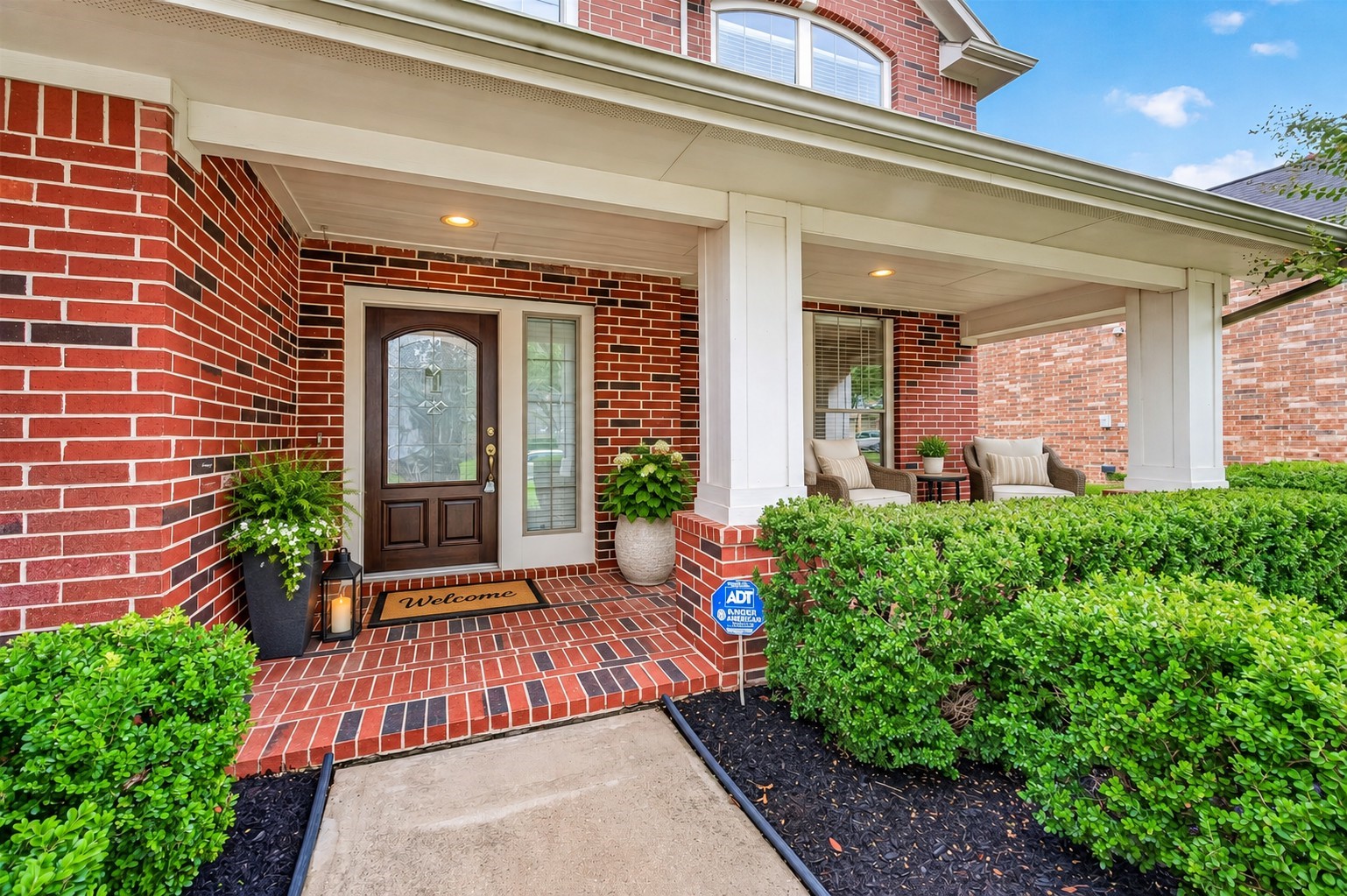 A charming covered brick front porch creates a warm, welcoming entrance with plenty of space to relax and enjoy. The brick detailing and sheltered entry add timeless character and inviting curb appeal. **Virtually Staged**