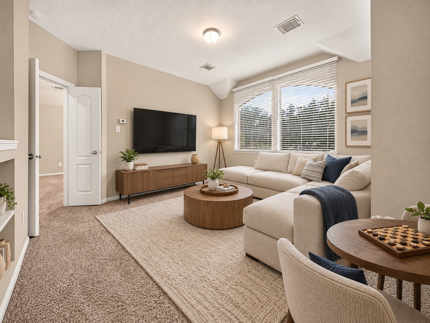The large window with blinds brings in plenty of natural light. Double doors provide direct access to the primary suite, creating a convenient connection while keeping the spaces distinct. **Virtually Staged**