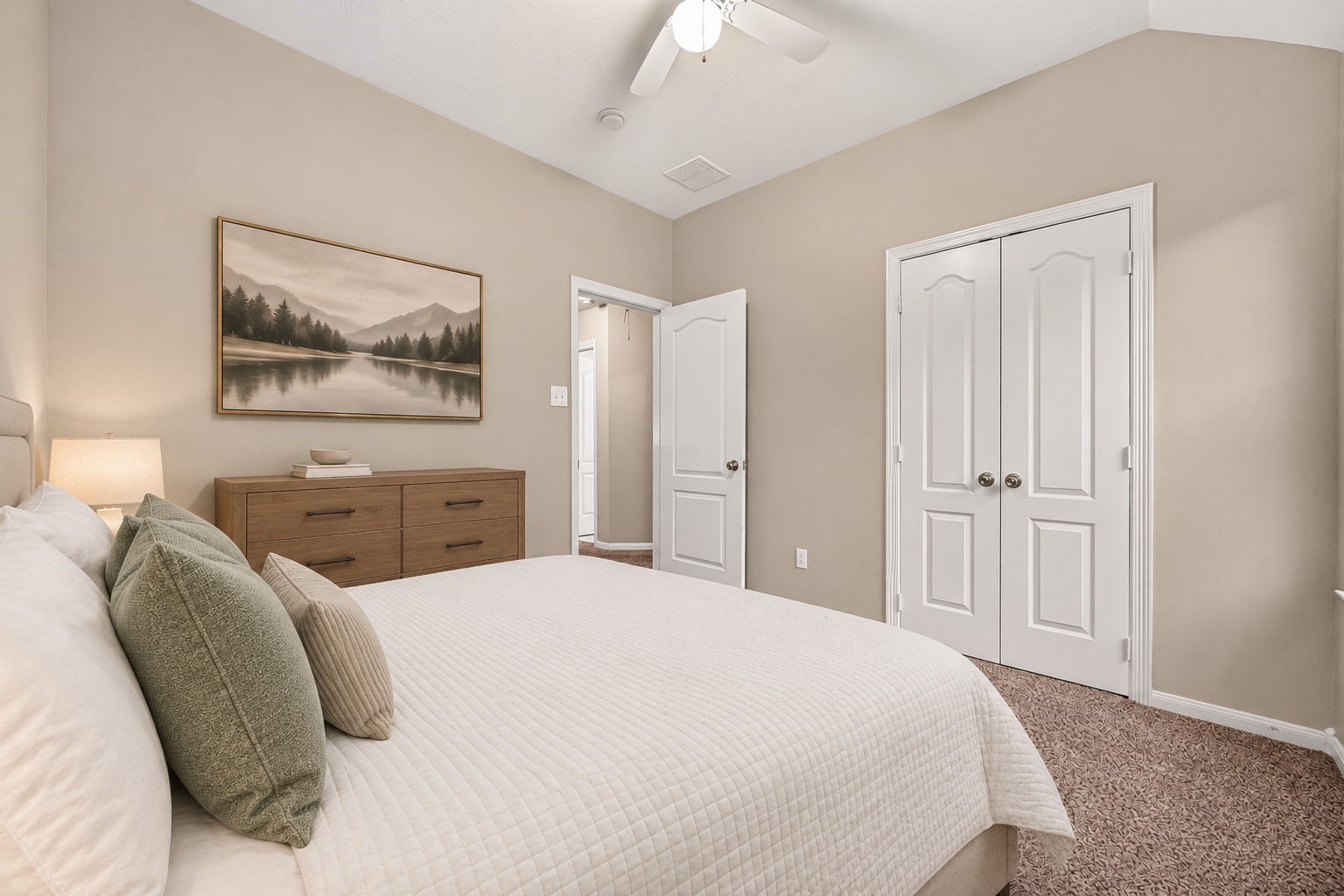 A soothing ceiling fan adds comfort to this inviting and functional room. The generous closet space offers room for added storage and organization. **Virtually Staged**