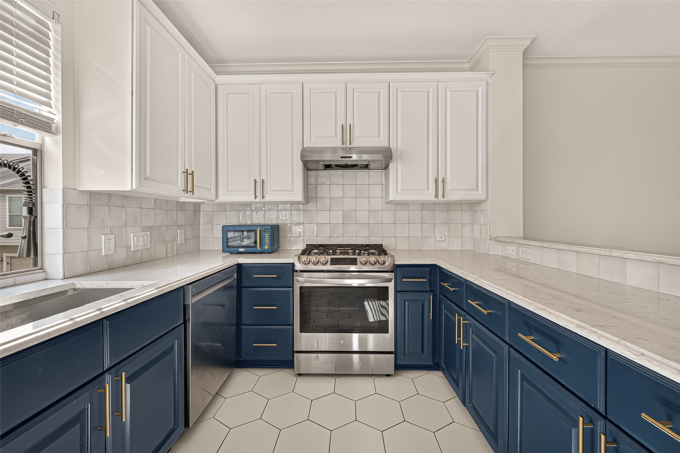 The kitchen offers plenty of counter space for meal preparation and ample cabinetry for storage, making it both functional and inviting.