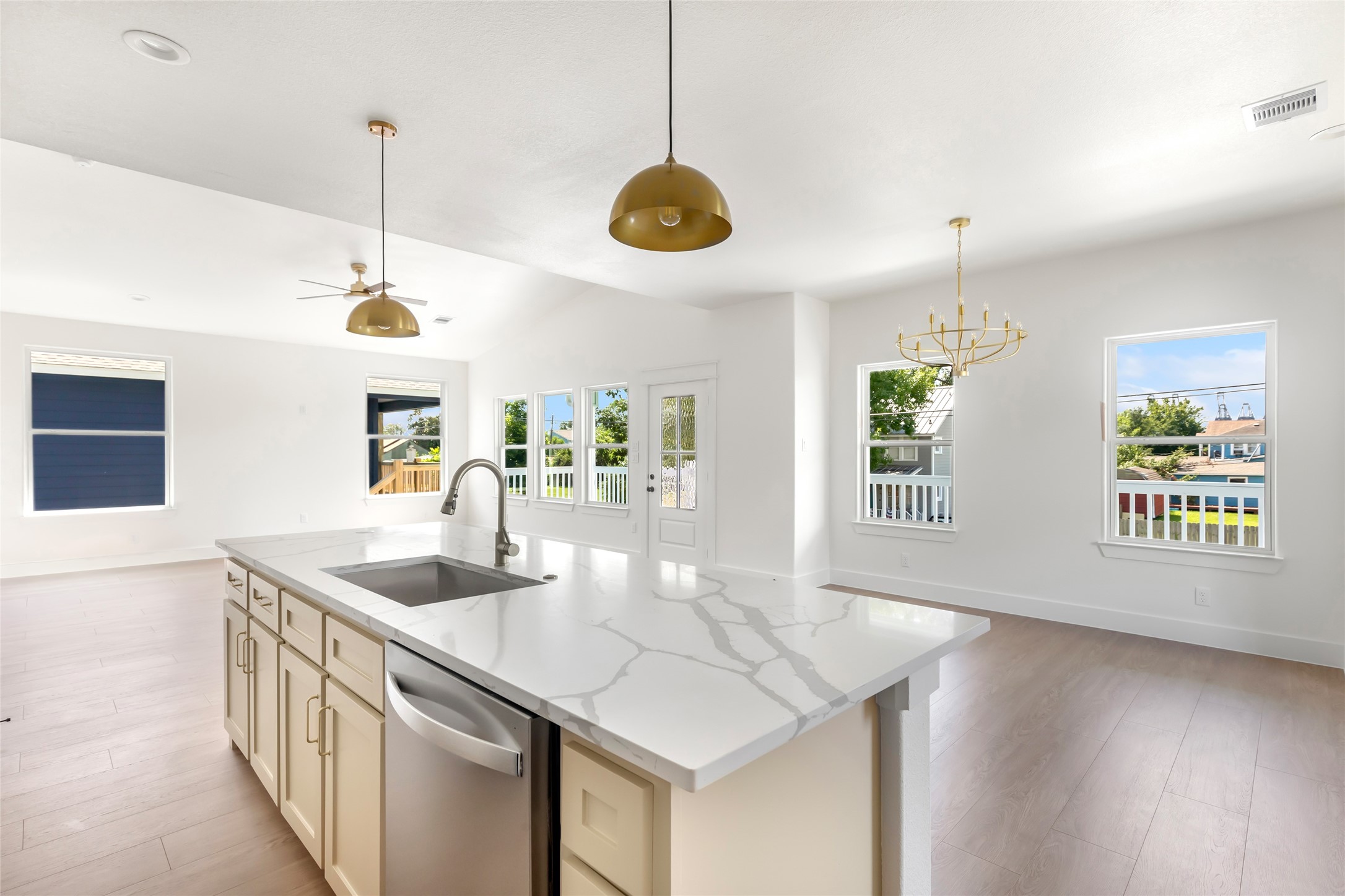 Experience the style and functionality in this bright, open-concept kitchen, dining, and living area, perfect for modern living and entertaining. Experience the style and functionality in this bright, open-concept kitchen, dining, and living area, perfect for modern living and entertaining.