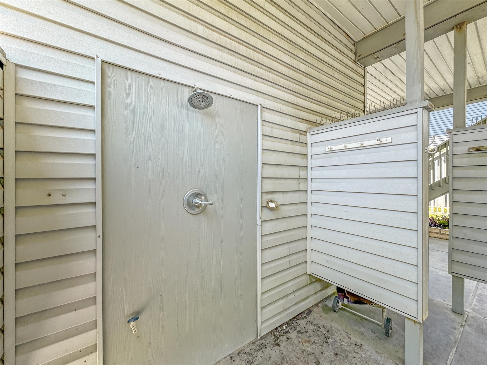This elevated coastal retreat offers an outdoor shower that is designed to be very private and convenient after a day enjoying the beach.  The shower has hot water as well as cold.