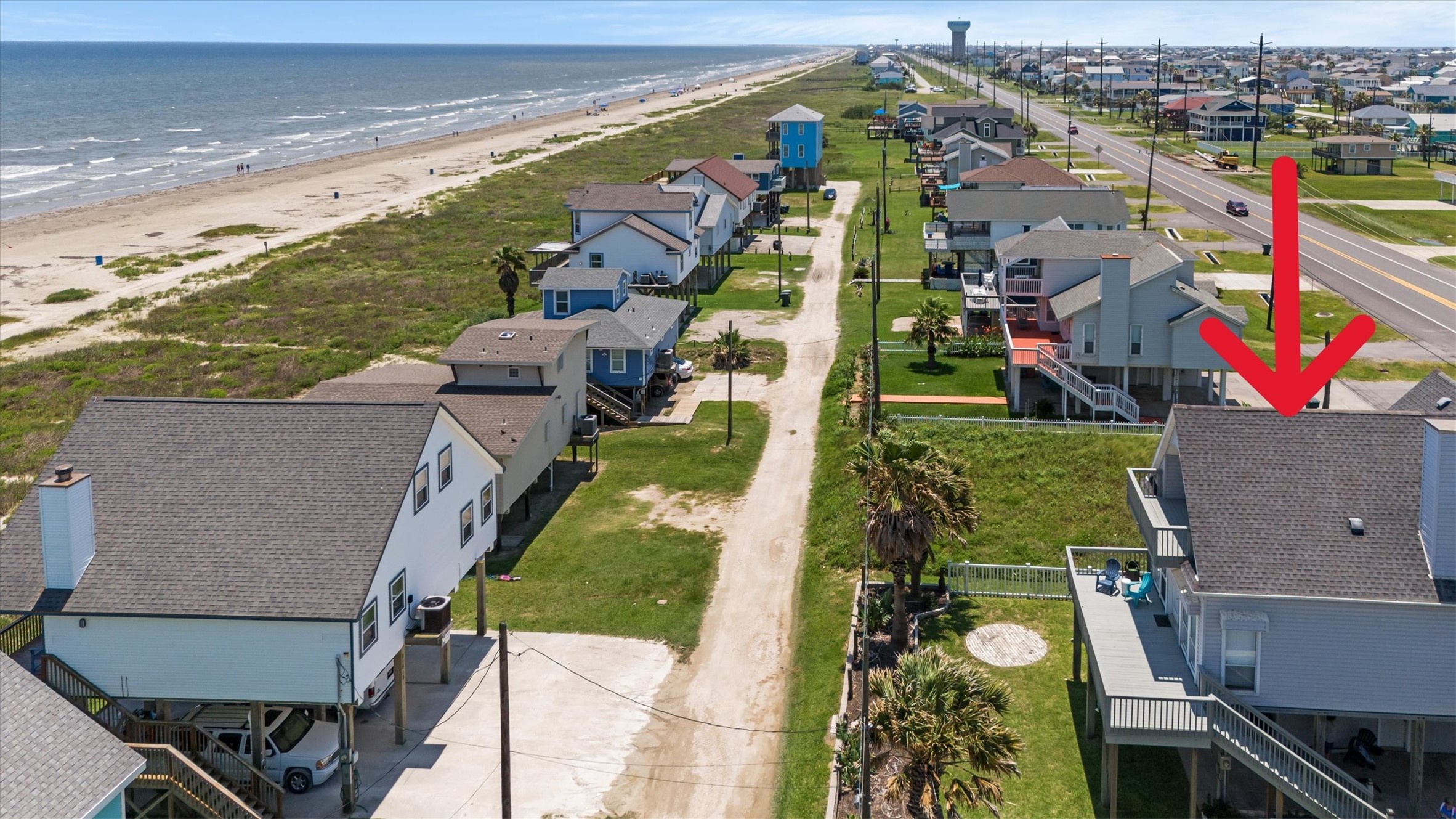 This coastal property is just steps from the beach.  It offers easy access to the ocean and a scenic beach view. Ideal for those seeking a relaxed, seaside lifestyle.