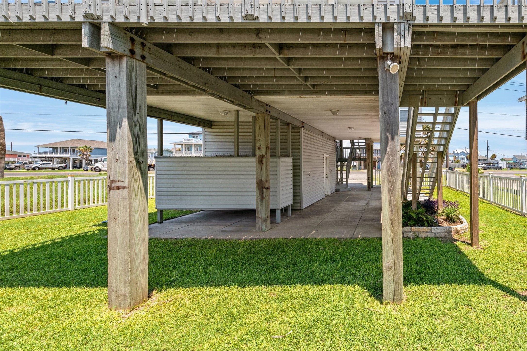 Experience the ultimate in convenience and privacy with this charming outdoor shower and dressing area, perfect for refreshing after a day in the sun.