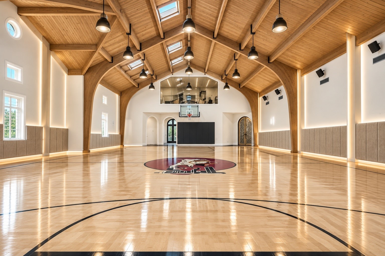 Few residences offer a private indoor, NBA size basketball facility of this scale, complete with an impressive vaulted ceiling, expansive court, and exceptional space for year-round competition and recreation.
