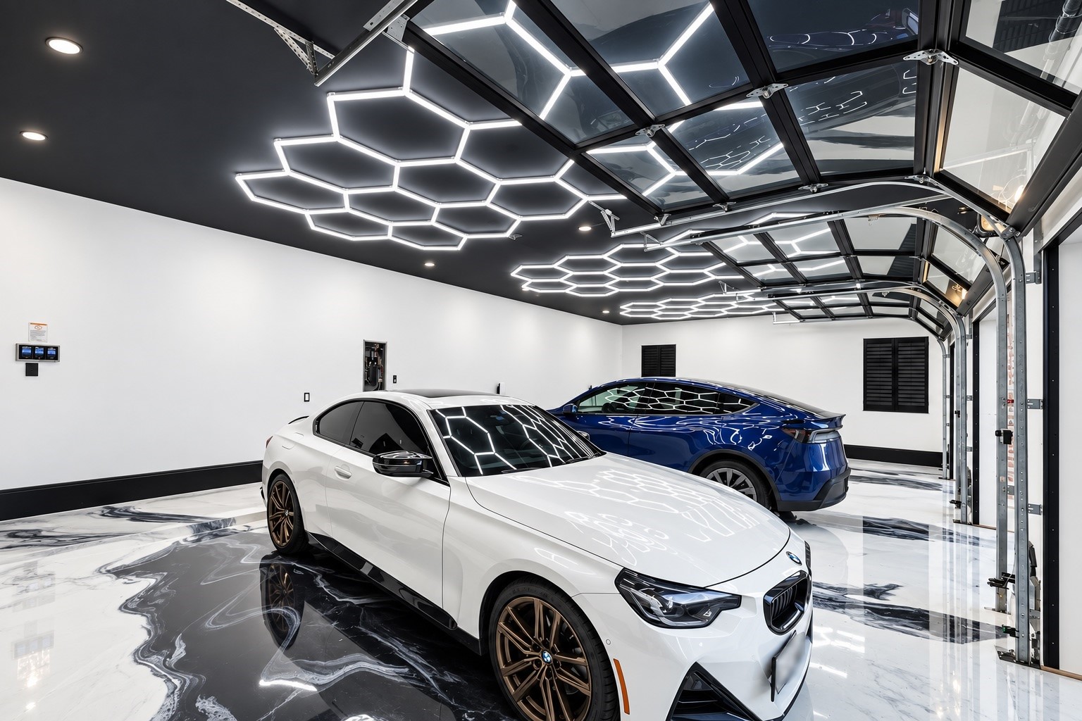 An impressive finished garage features dramatic contemporary lighting, generous vehicle accommodation, and a polished presentation suited to luxury automobiles and collector vehicles.