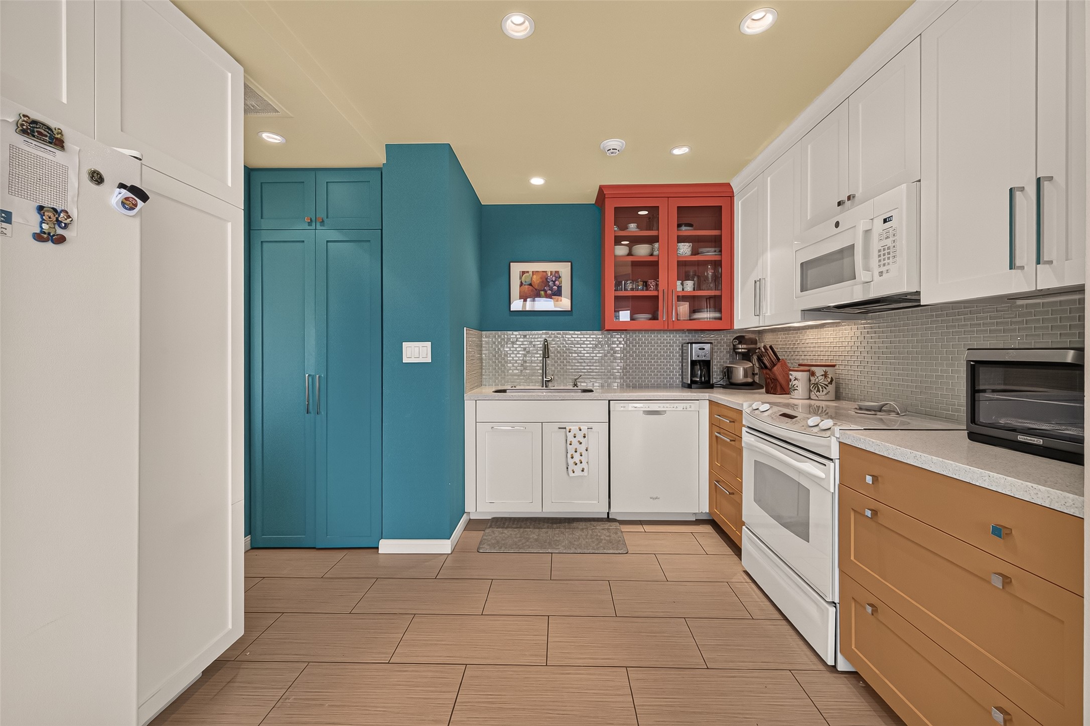 Stacked washer and dryer in the tall closet to the left
