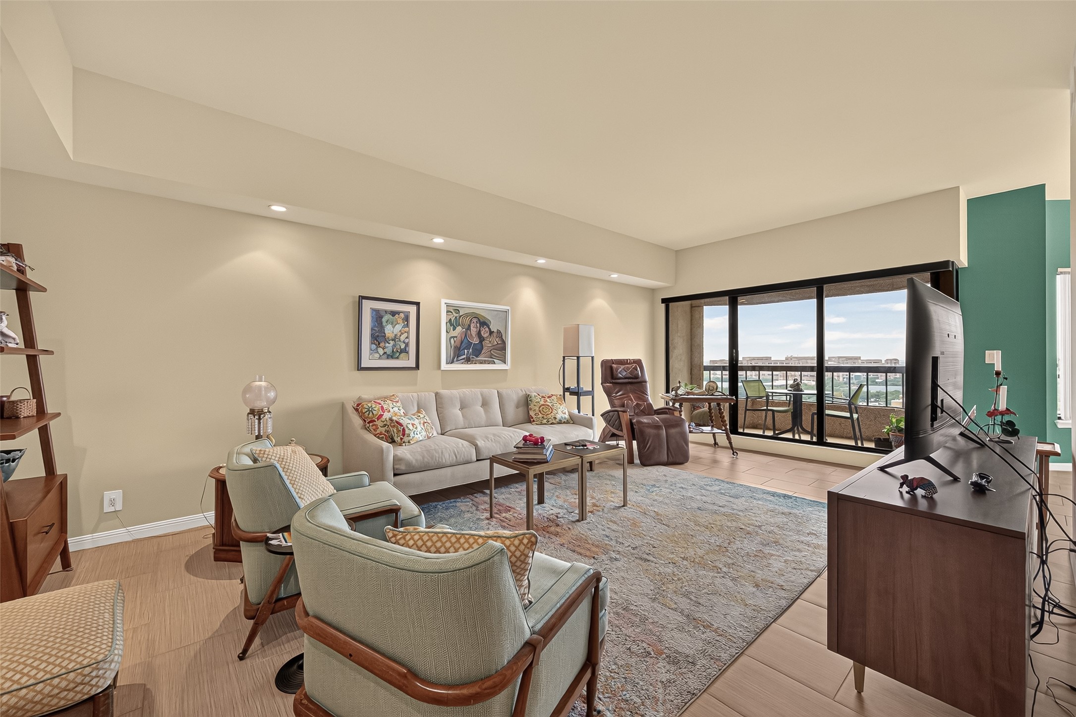 spacious living room with balcony access
