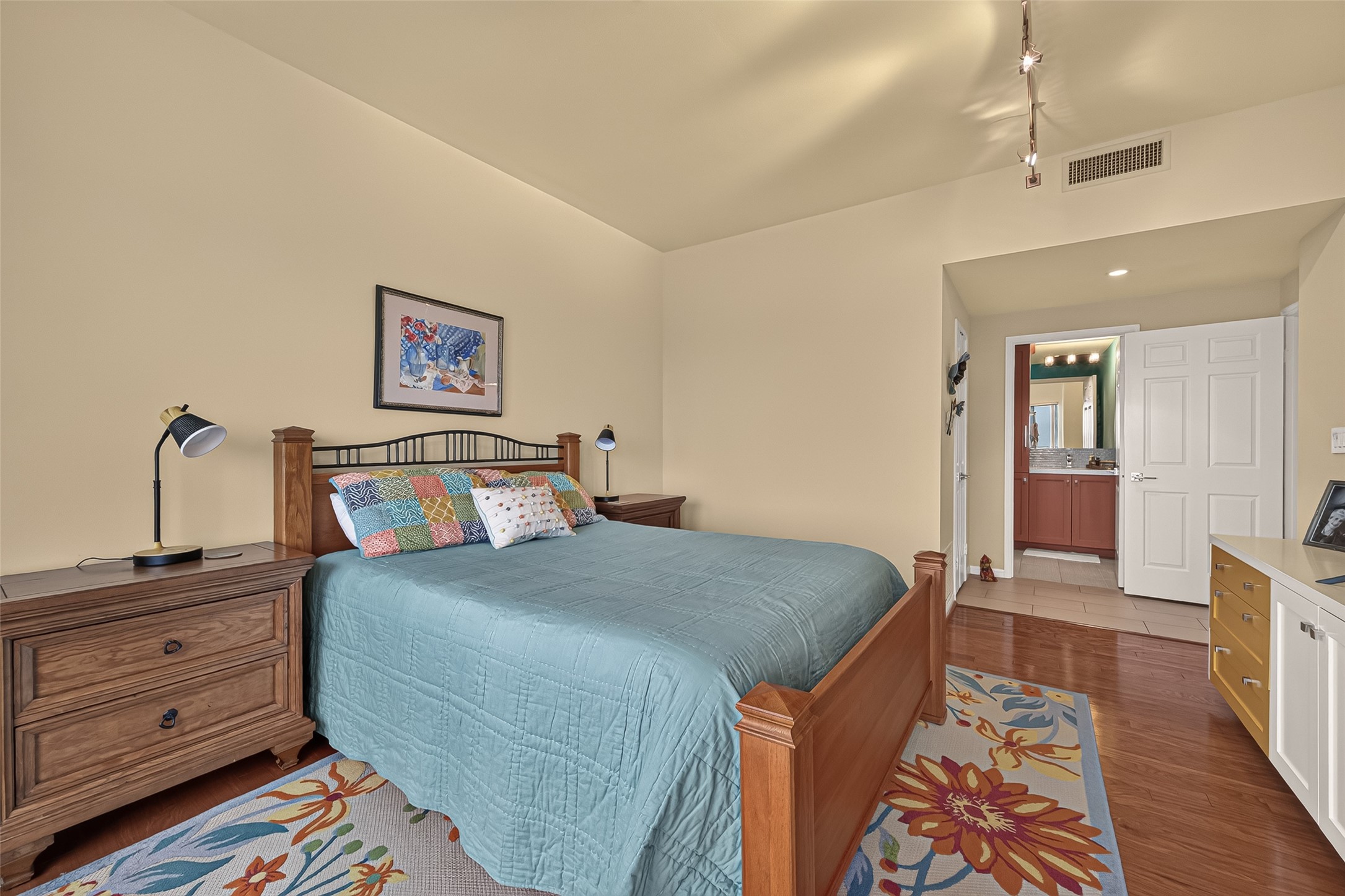 primary bedroom with ensuite closet and bath