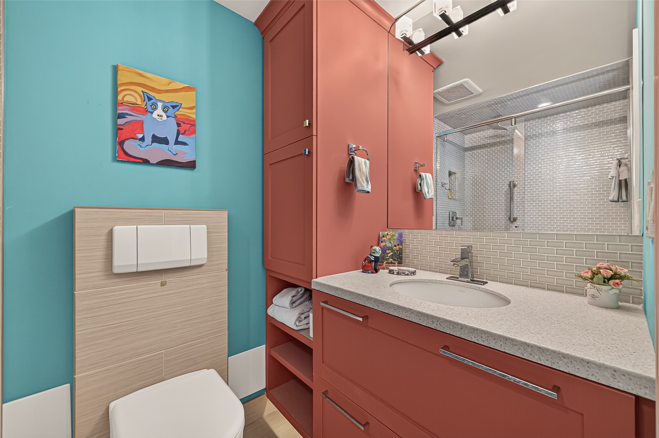 secondary bathroom with under cabinet lighting
