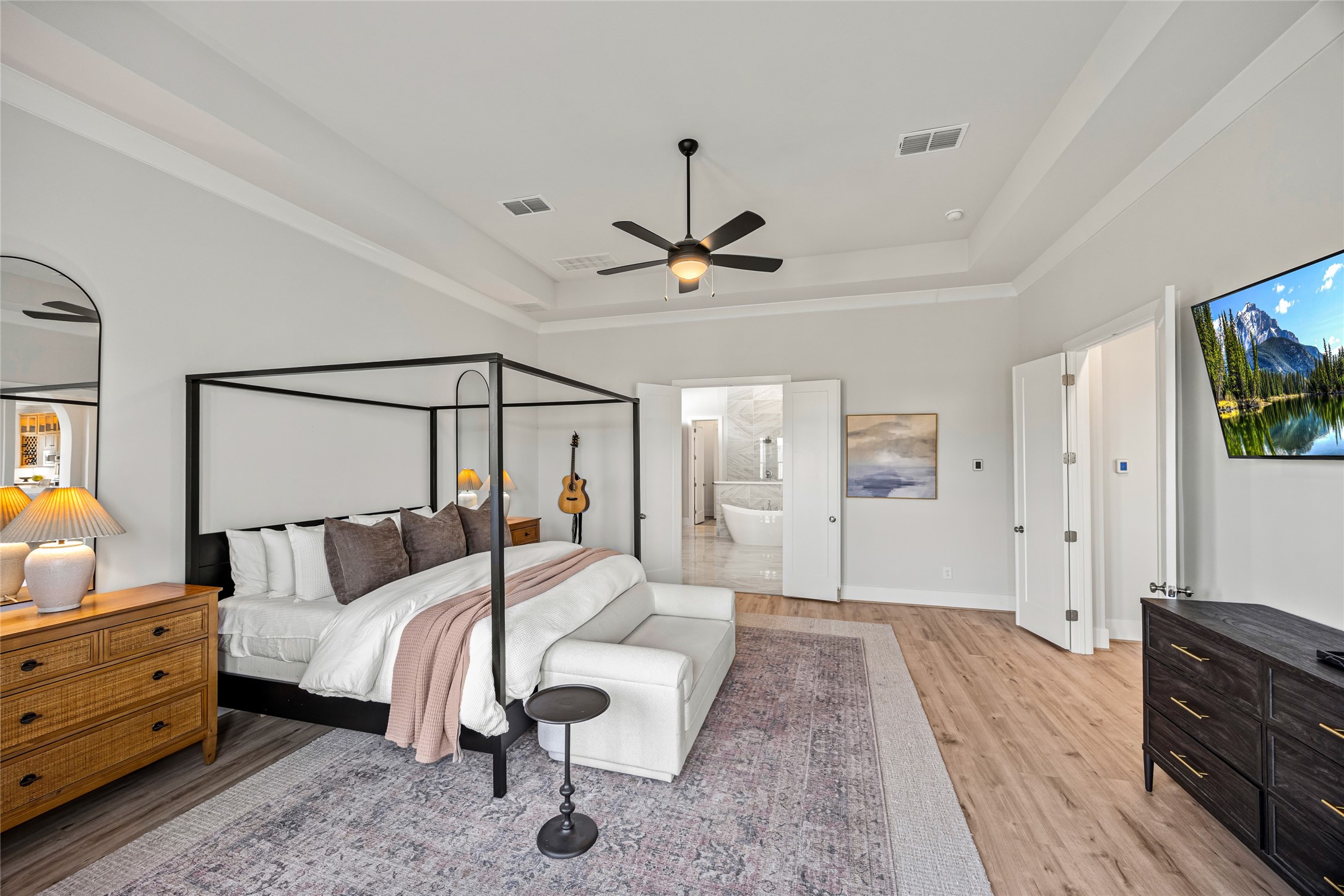 This majestic master suite combines grand proportions with breathtaking water views, offering a truly royal retreat