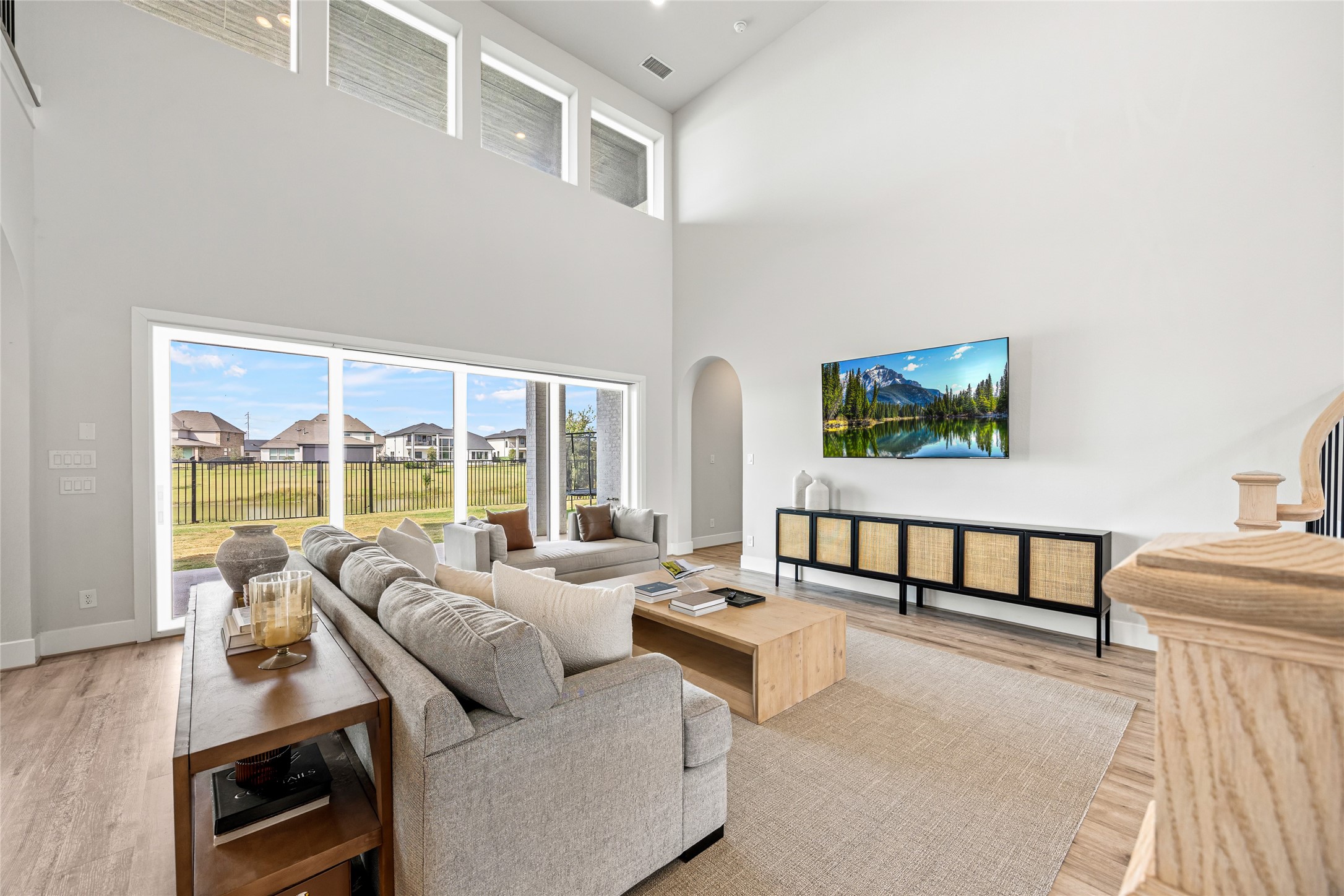 High ceilings and expansive windows showcase stunning water views and fill the space with natural light