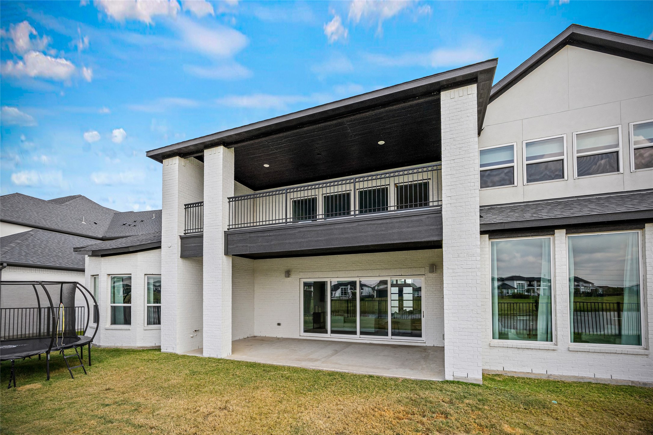 A stunning backyard retreat overlooking the water, offering dual patiosone downstairs and one upstairsperfect for relaxing or entertaining