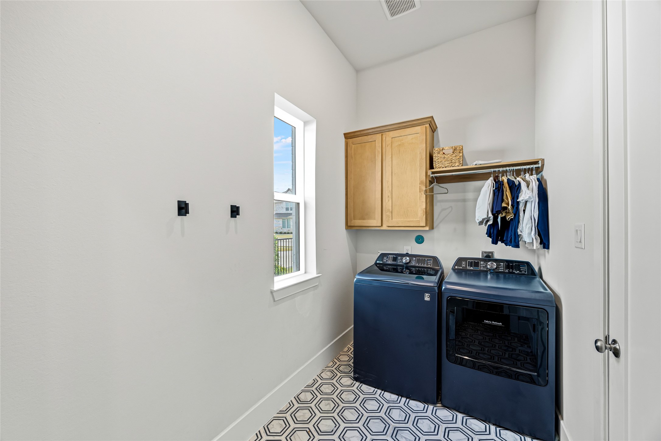A beautiful, sunlit laundry room that makes everyday chores feel effortless