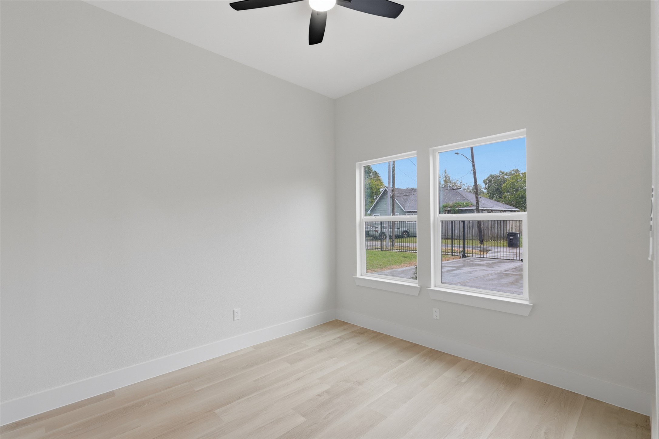 Bright and airy room featuring light LVP flooring, fresh white walls, and easy access to an adjoining private bathroom, perfect one of the four bedrooms facing the front entrance Bright and airy room featuring light LVP flooring, fresh white walls, and easy access to an adjoining private bathroom, perfect one of the four bedrooms facing the front entrance