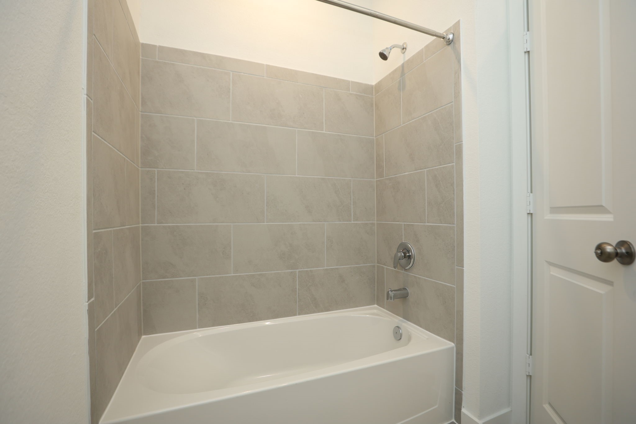 3rd bathroom has a combination Shower/tub.