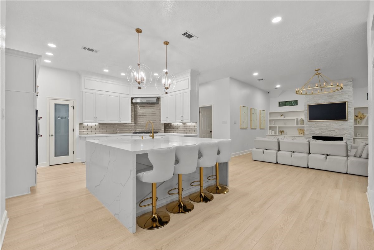 The heart of the home is nothing short of spectacular. This designer kitchen combines timeless elegance with everyday functionality, creating a space that's destined to become everyone's favorite gathering place.