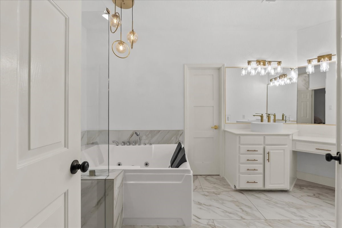 Designed with both beauty and function in mind, this impressive primary suite features a massive walk-in closet offering exceptional storage and space to create your own private dressing retreat.