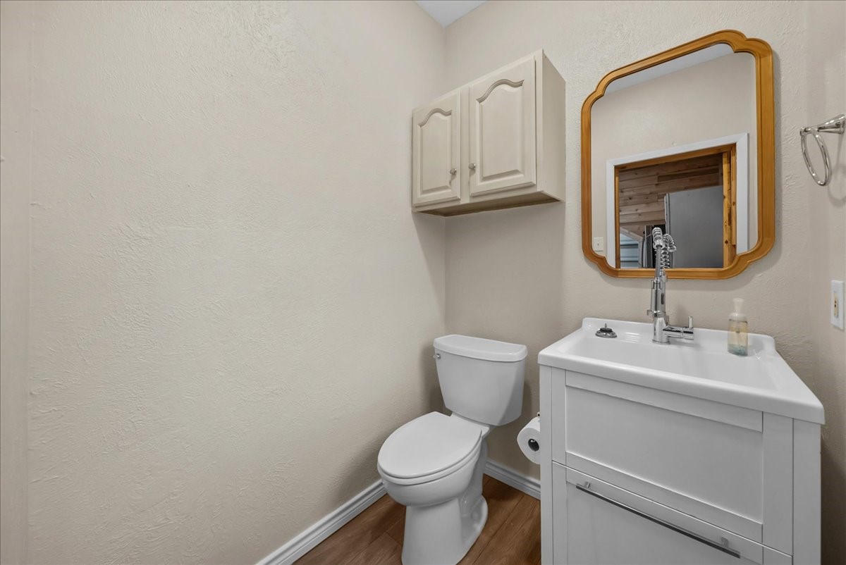The garage includes a conveniently located half bath, offering added comfort and functionality for this exceptional space.