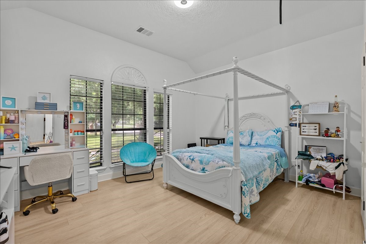 Tucked away down the hallway, this spacious guest bedroom offers an abundance of natural light and plenty of room for comfortable furnishings, guests, or personal touches.
