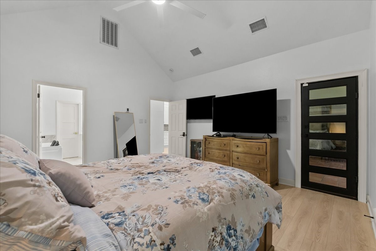 Wake up to a private retreat filled with comfort and tranquility. The spacious primary suite features a custom door leading to the patio, creating a seamless connection to your outdoor oasis.
