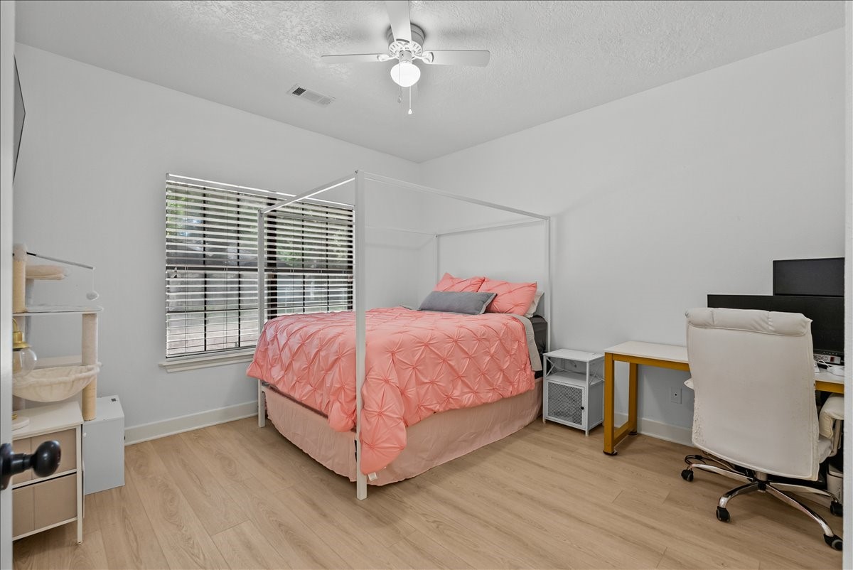 A beautifully sized secondary bedroom featuring great natural lighting and a versatile layout, perfect for a guest suite, home office, or whatever fits your lifestyle.