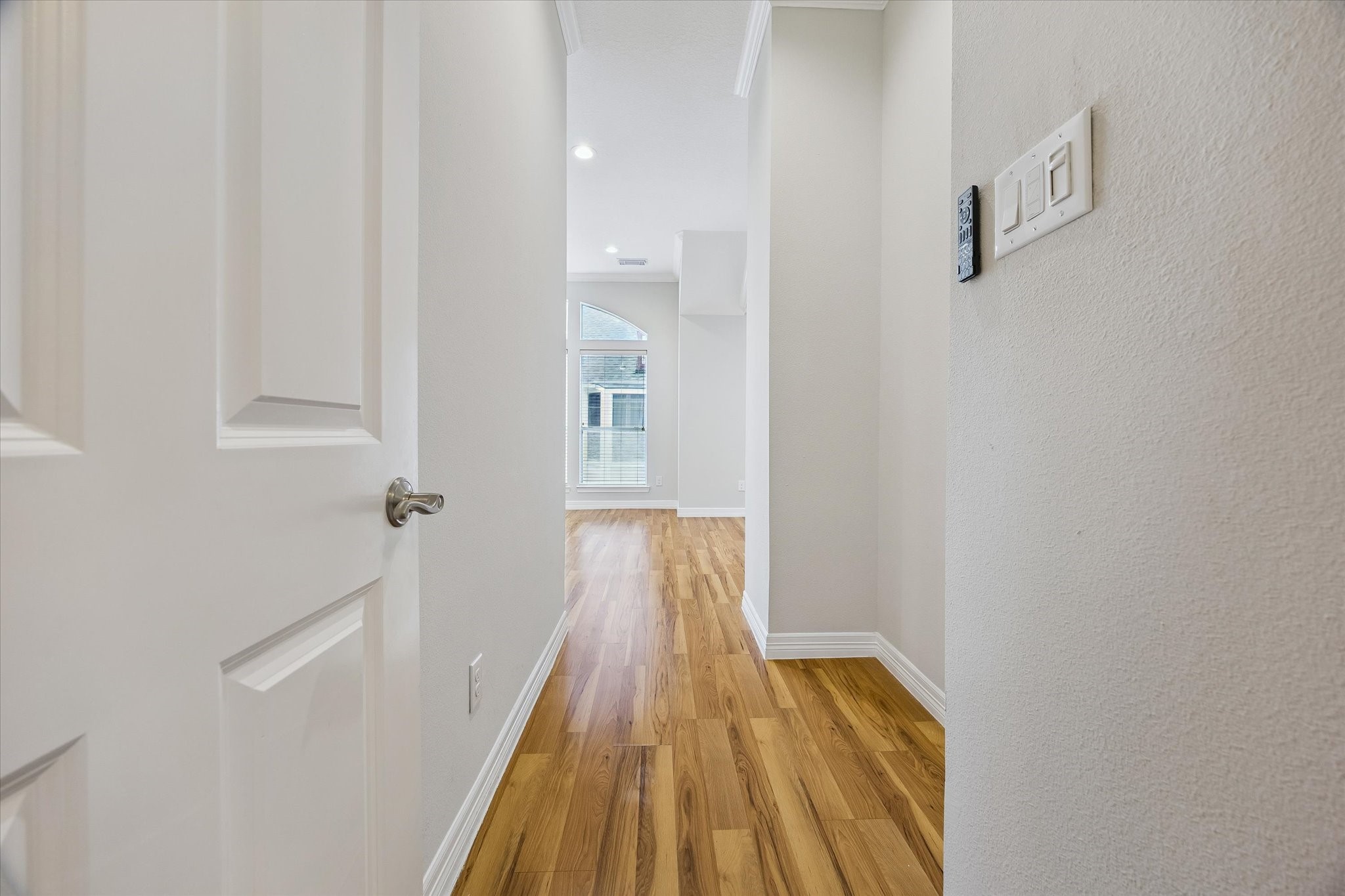 Moving to the third floor, the primary even has its own little entry hallway. Niche in wall could be great spot for a console to drop off everyday items or maybe a bookshelf for your personal library or collectibles!