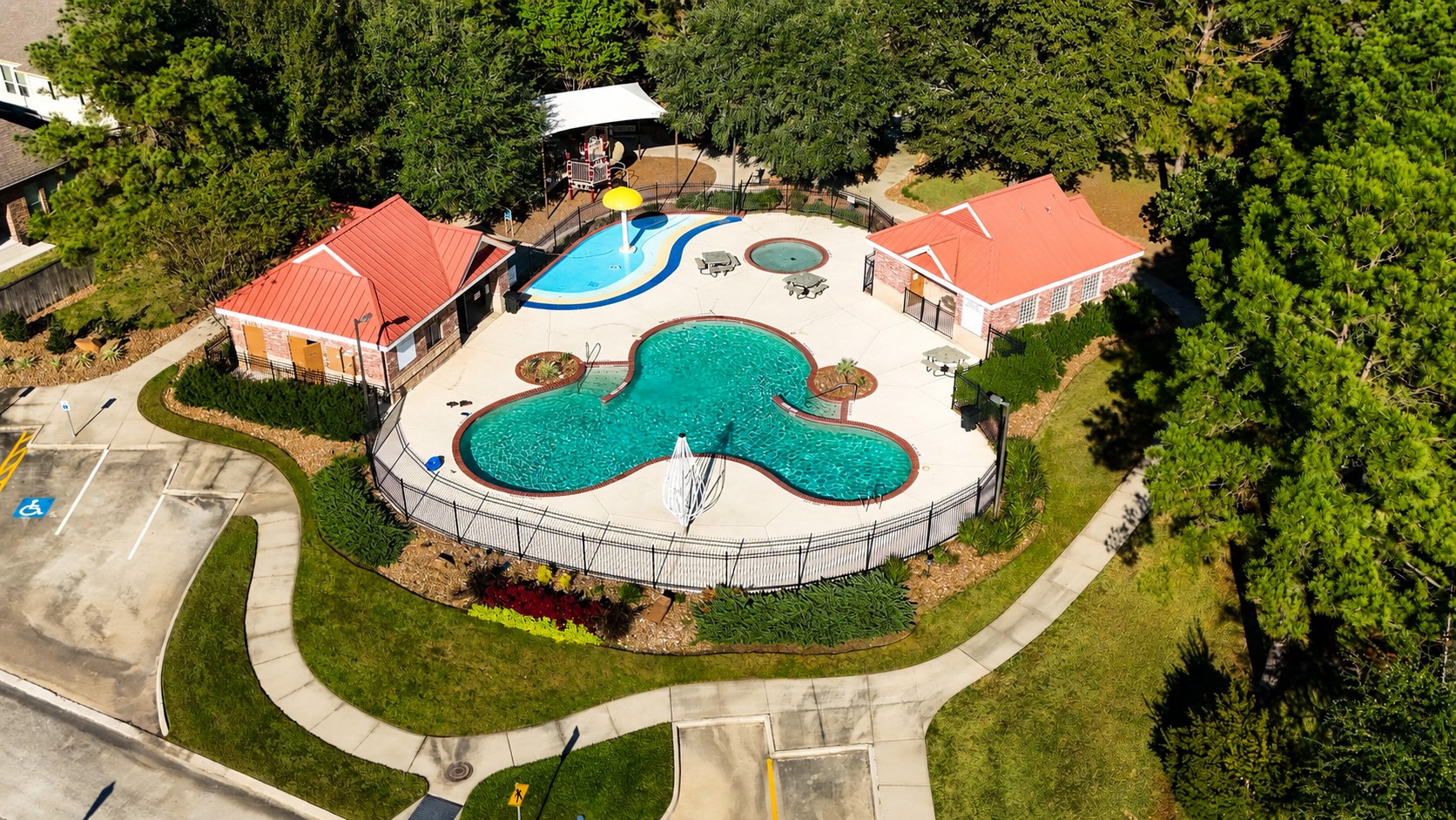 Lakes of Cypress Forest amenities add another layer to the water-view lifestyle, with a community pool, splash pad, shaded seating areas, and nearby paths surrounded by mature greenery. Its an easy extension of the neighborhoods outdoor feel, giving residents another place to swim, relax, and enjoy time outside close to home.