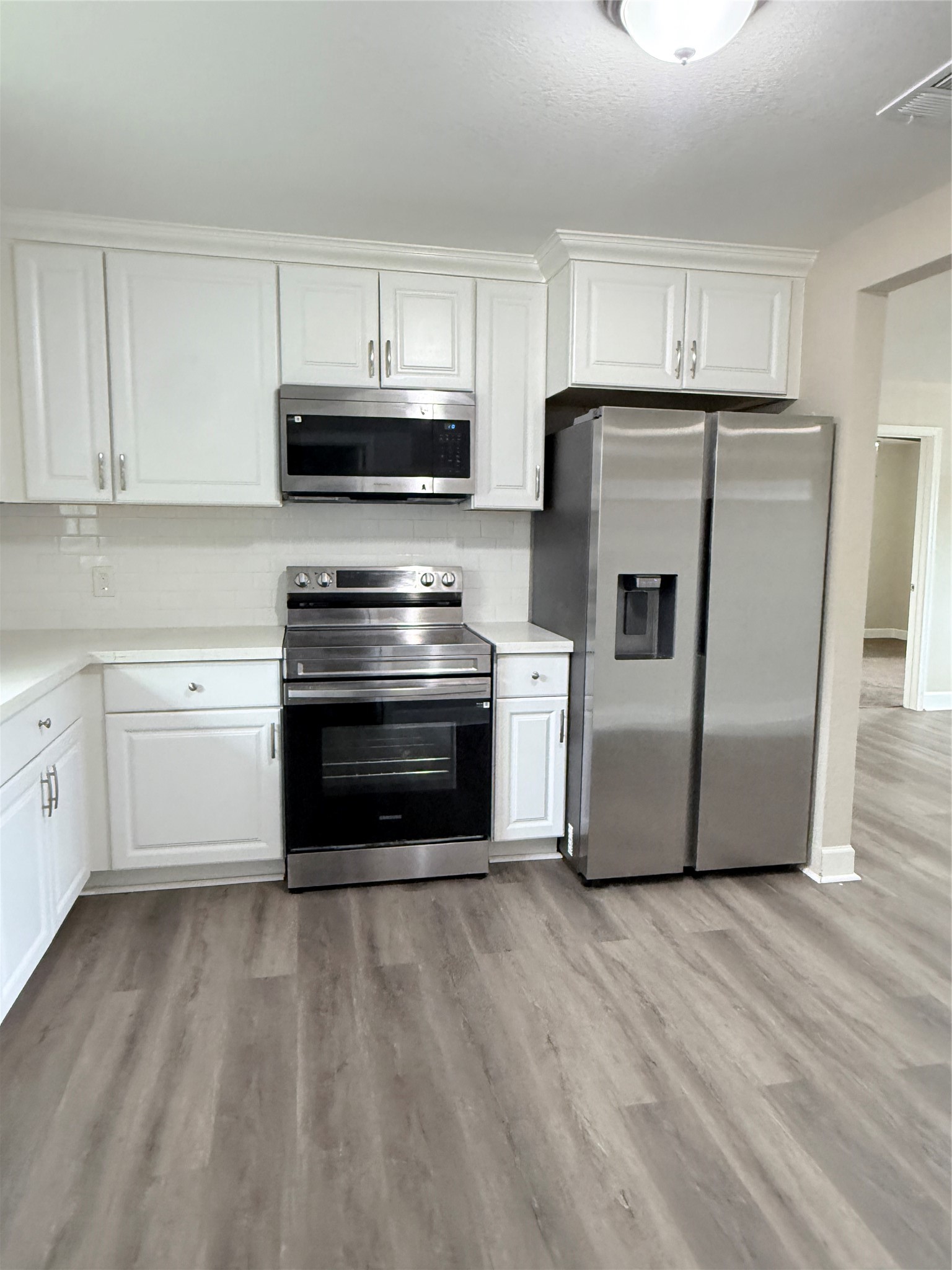 Modern stainless steel appliances, upgraded in 2025, enhance the kitchen's functionality and style. Modern stainless steel appliances, upgraded in 2025, enhance the kitchen's functionality and style.