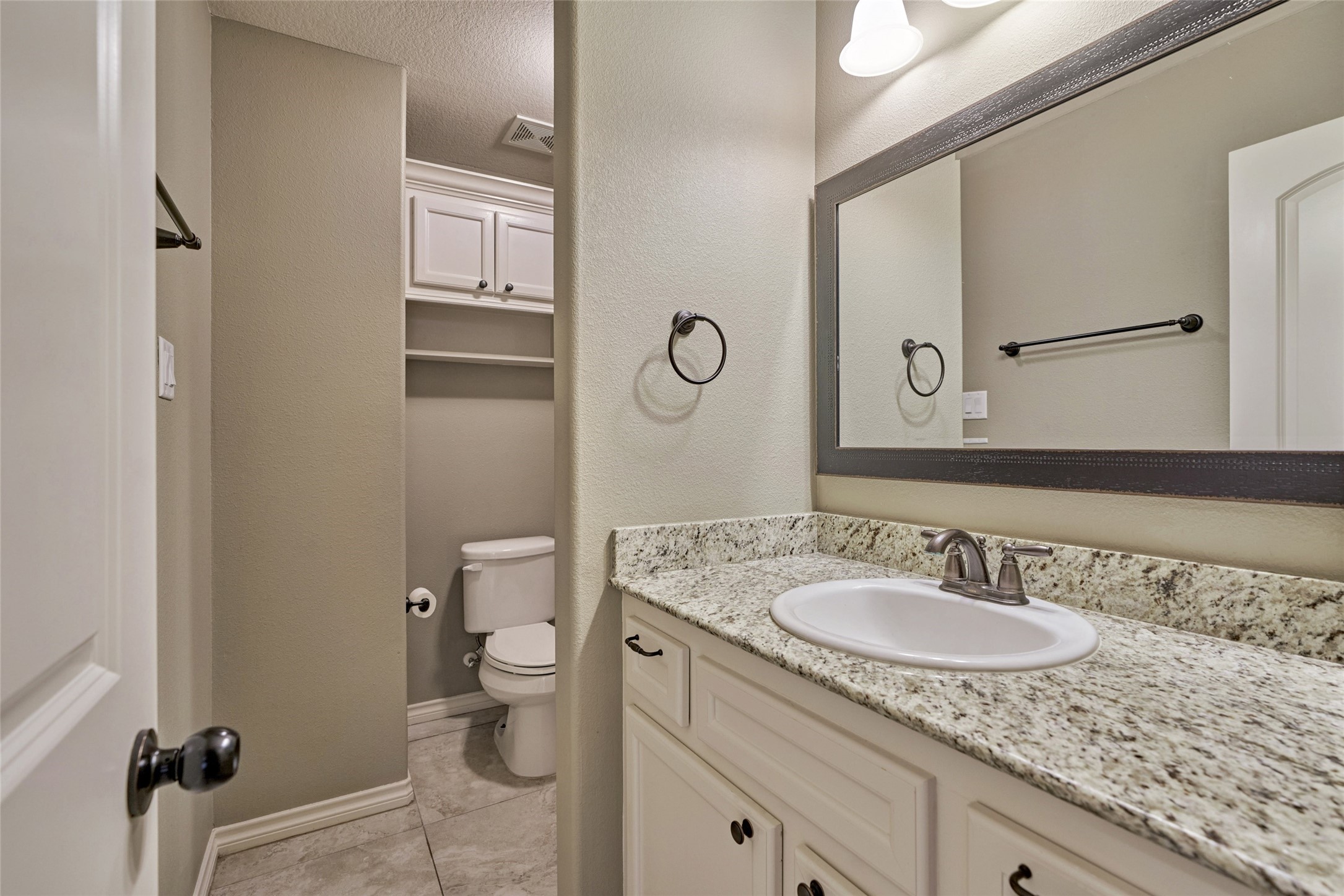 Shared bathrooms for both secondary bedrooms.