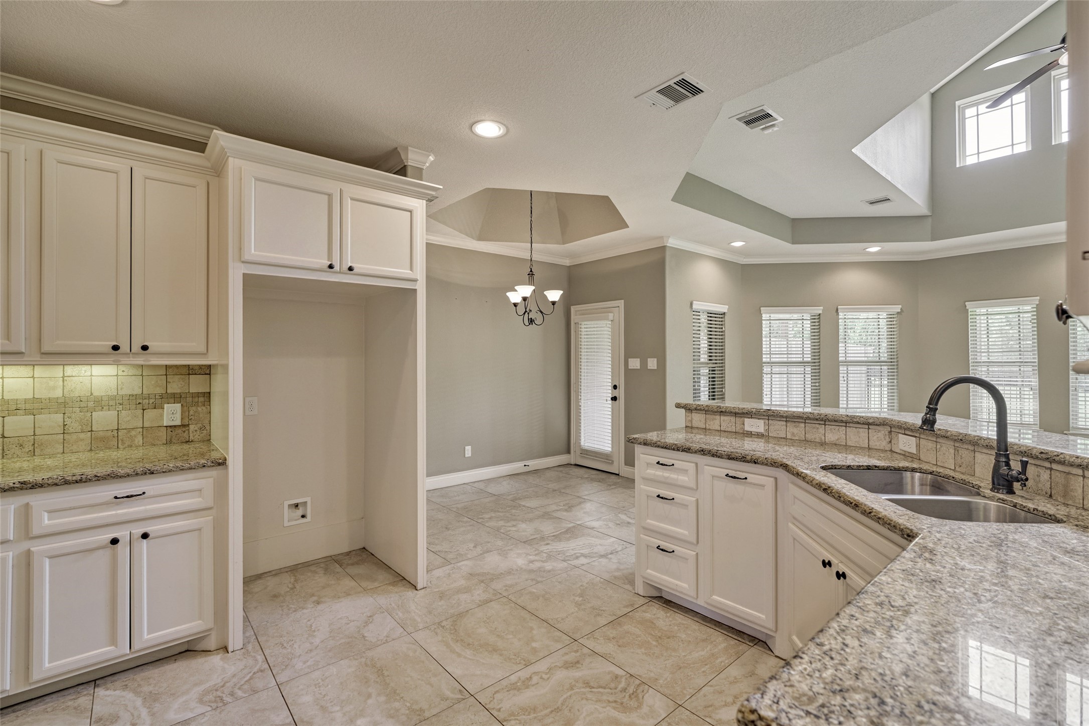 Just off of the breakfast room is the patio door that gives access to the backyard.
