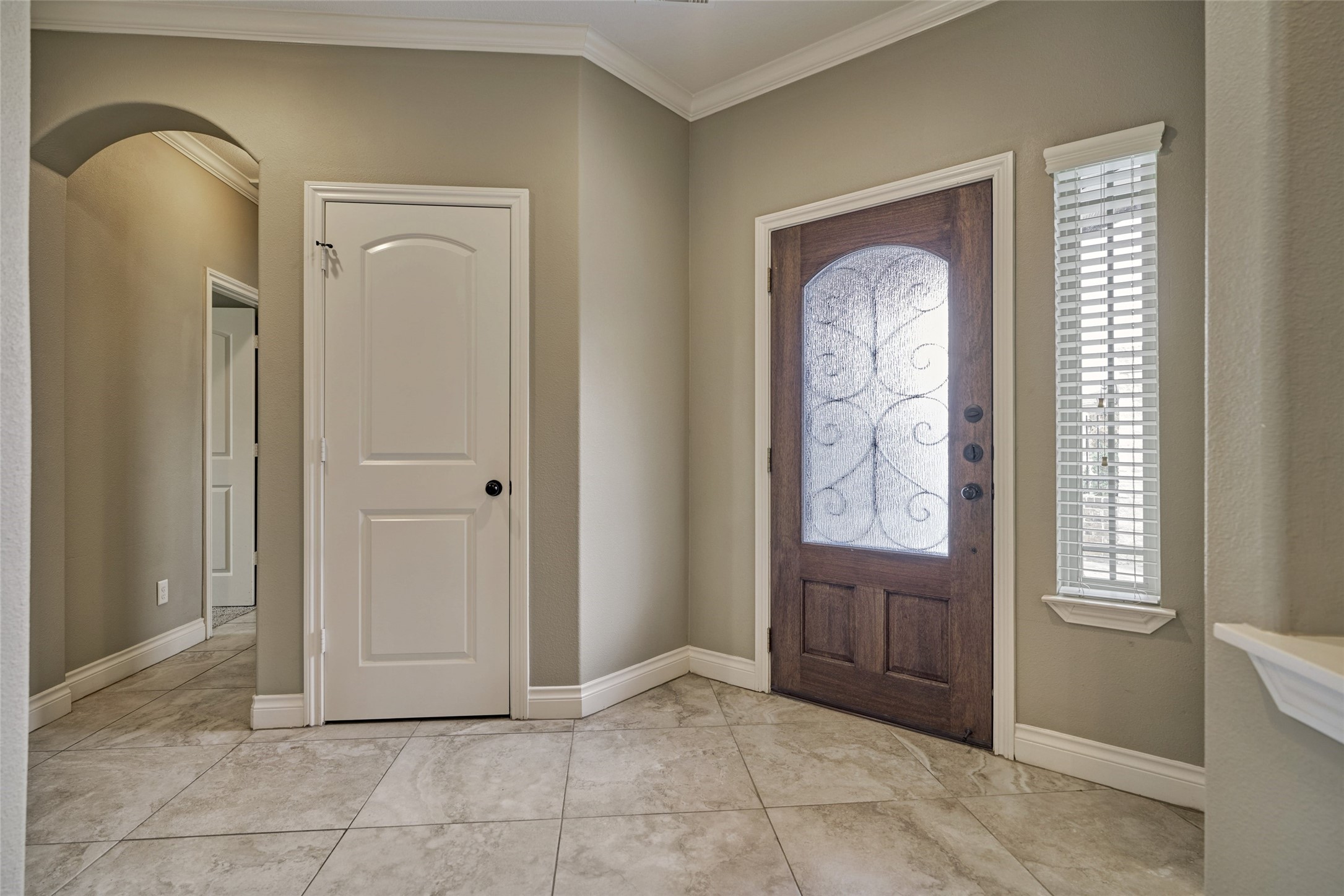 The opposite side of the foyer has a coat closet.