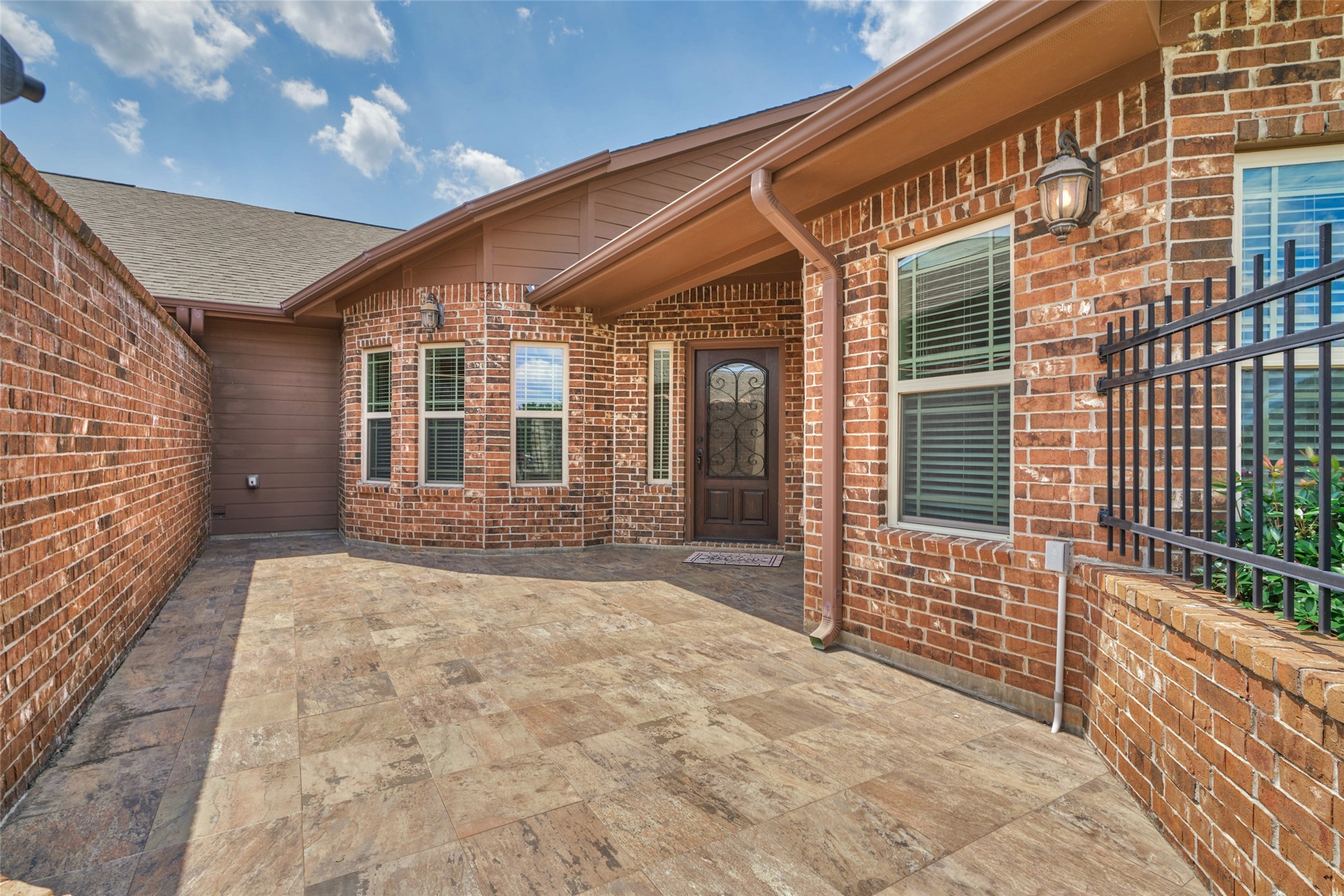 Gated entryway/patio area to welcome guests. Gated entryway/patio area to welcome guests.
