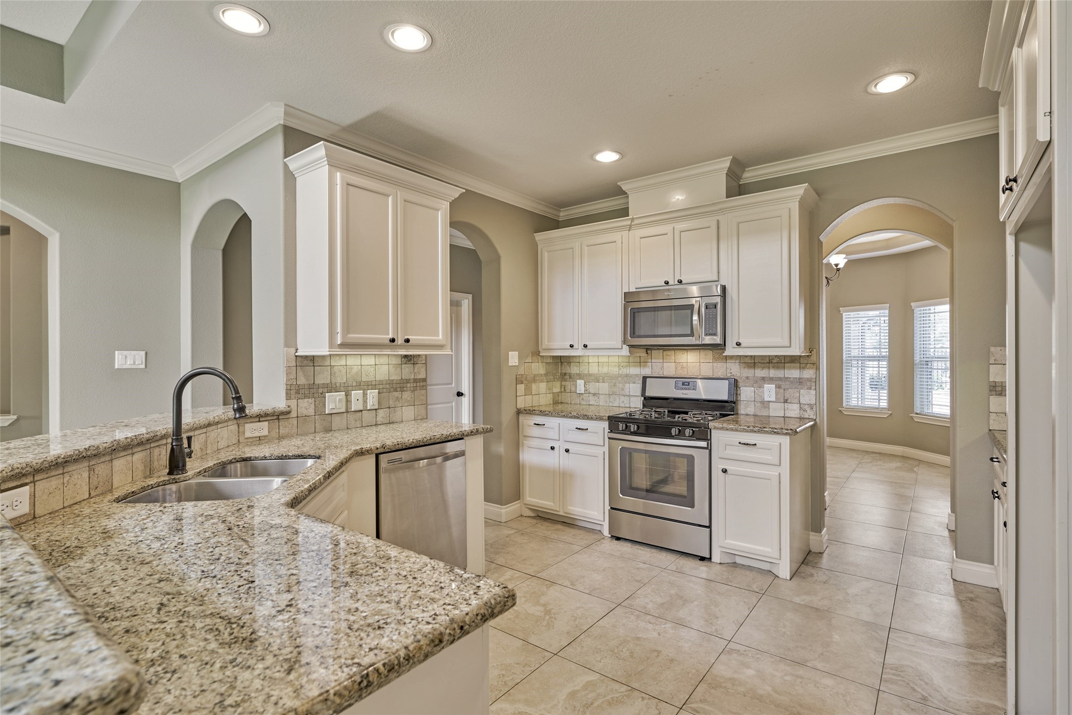 Gleaming granite countertops and stainless steel appliances in this well-built townhome.