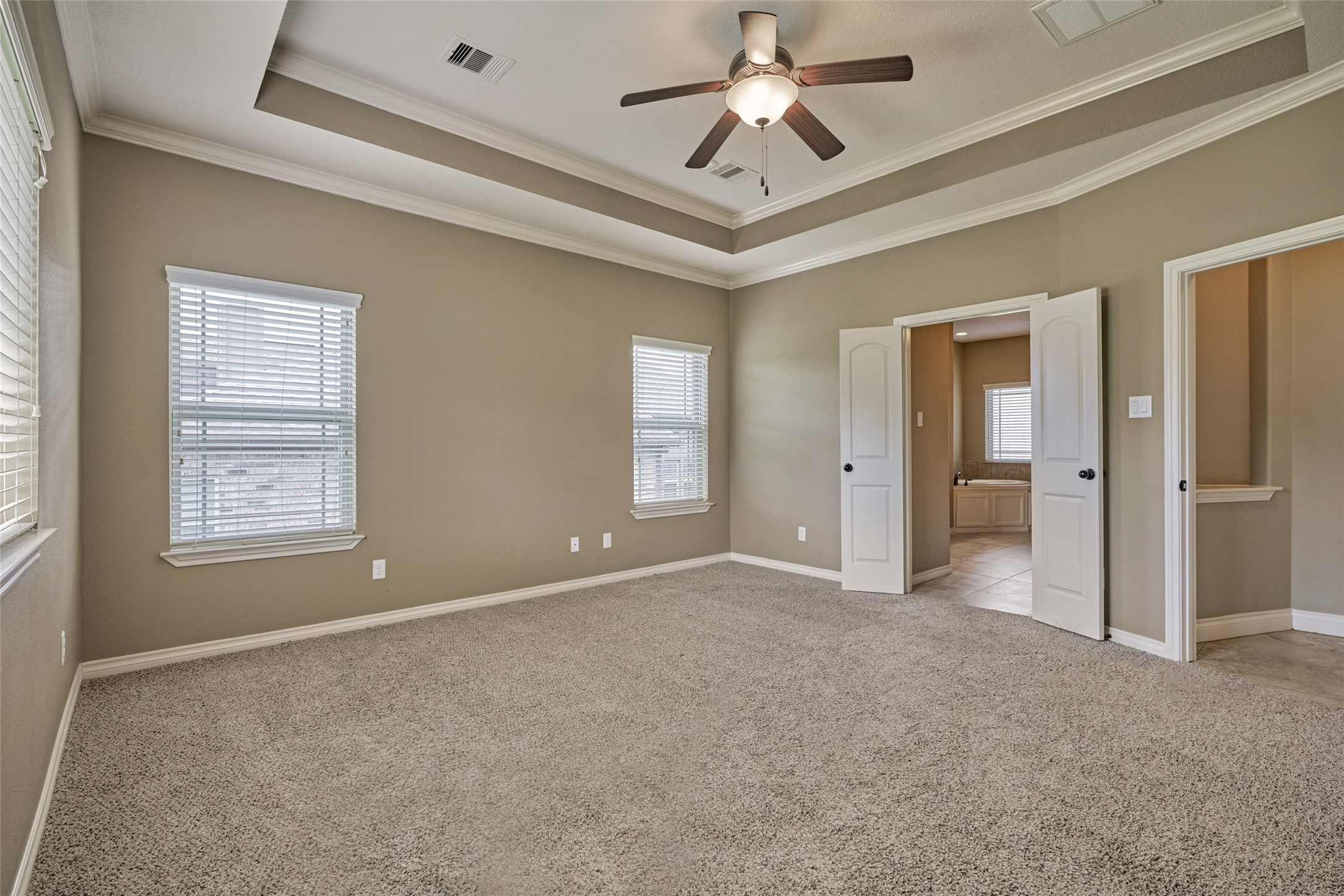 French doors lead to the primary ensuite.