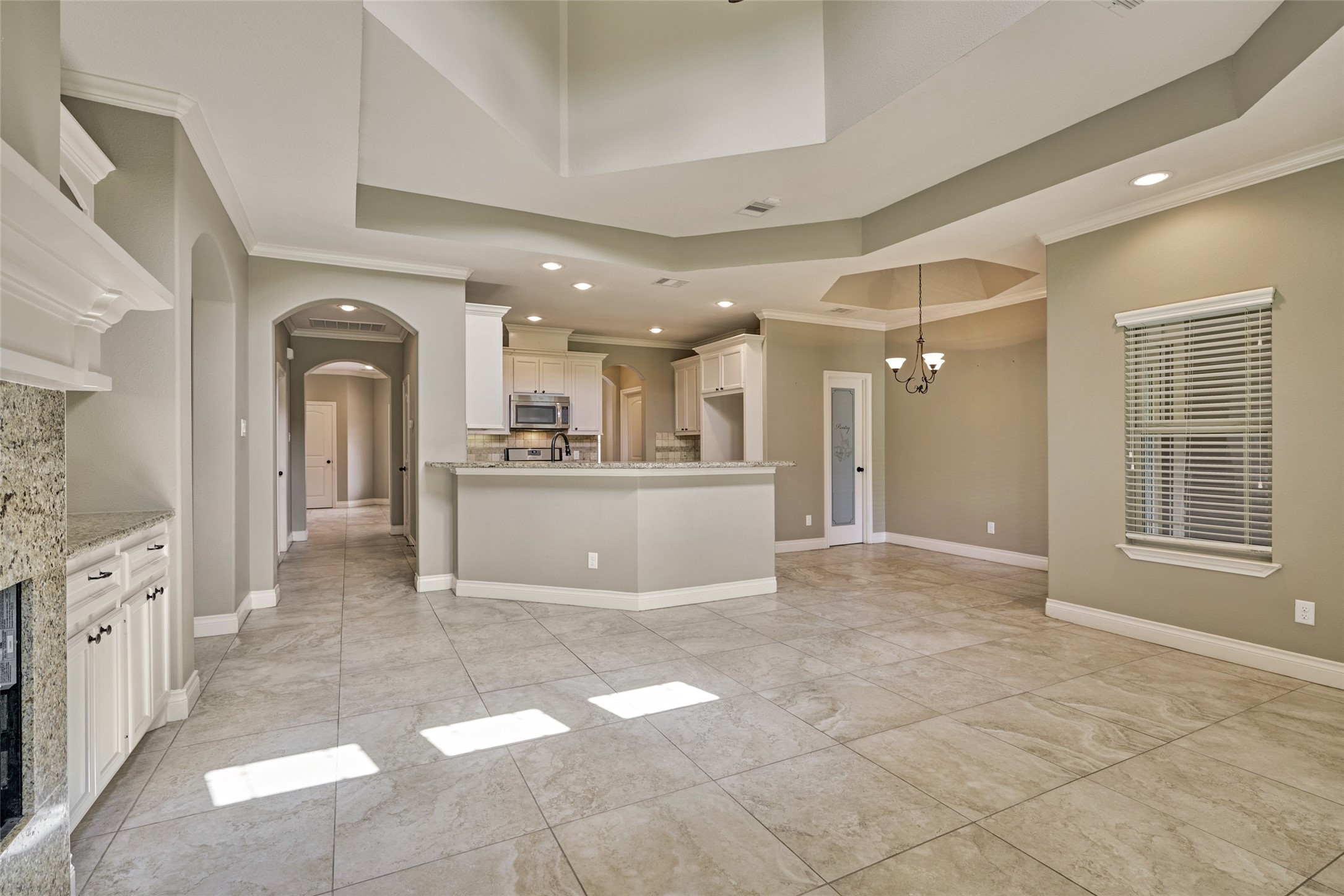 A view of the kitchen and breakfast area from the living room. The kitchen is centrally located allowing a nice flow.
