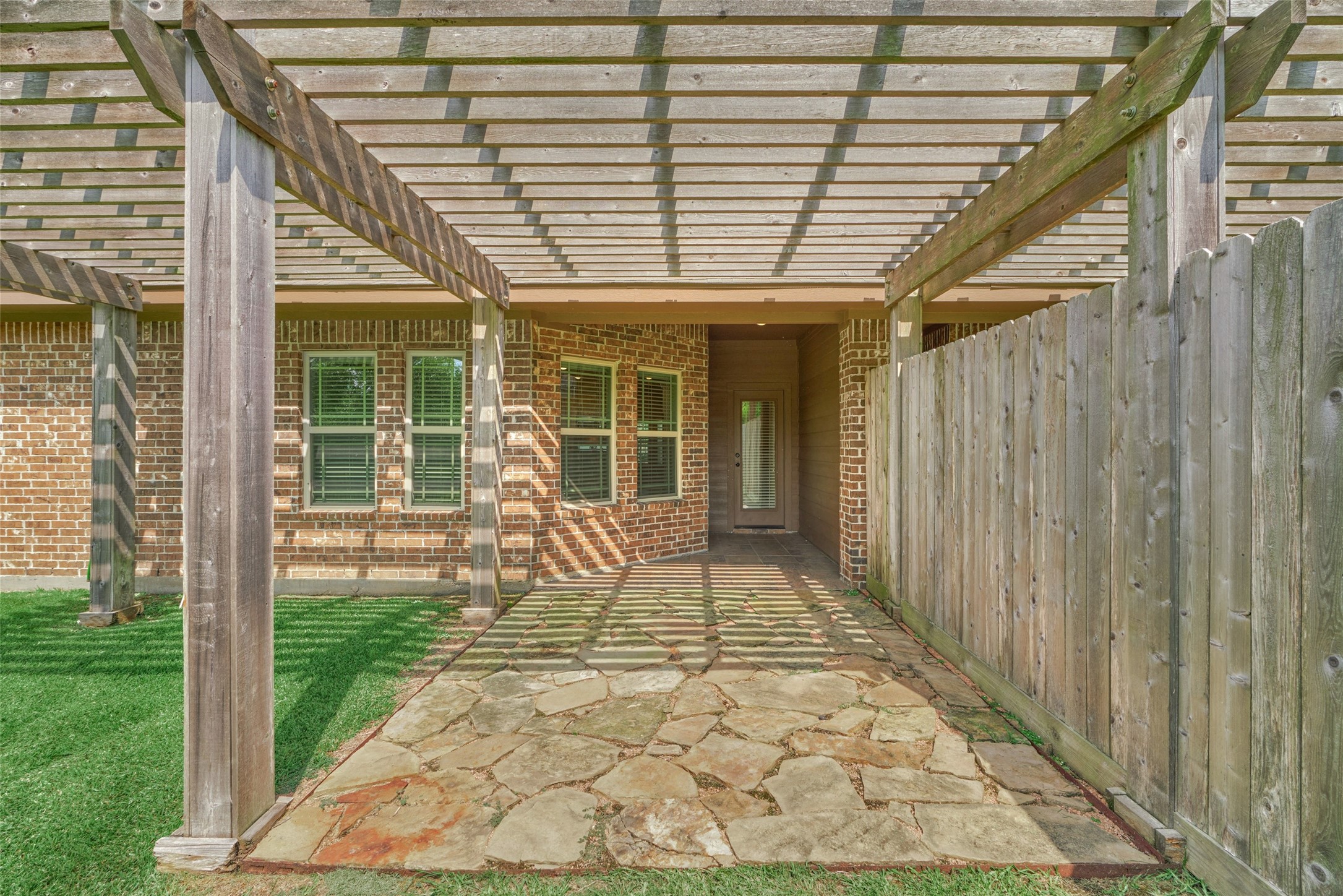 Back patio with pergola to enjoy your morning coffee or afternoon cocktail.