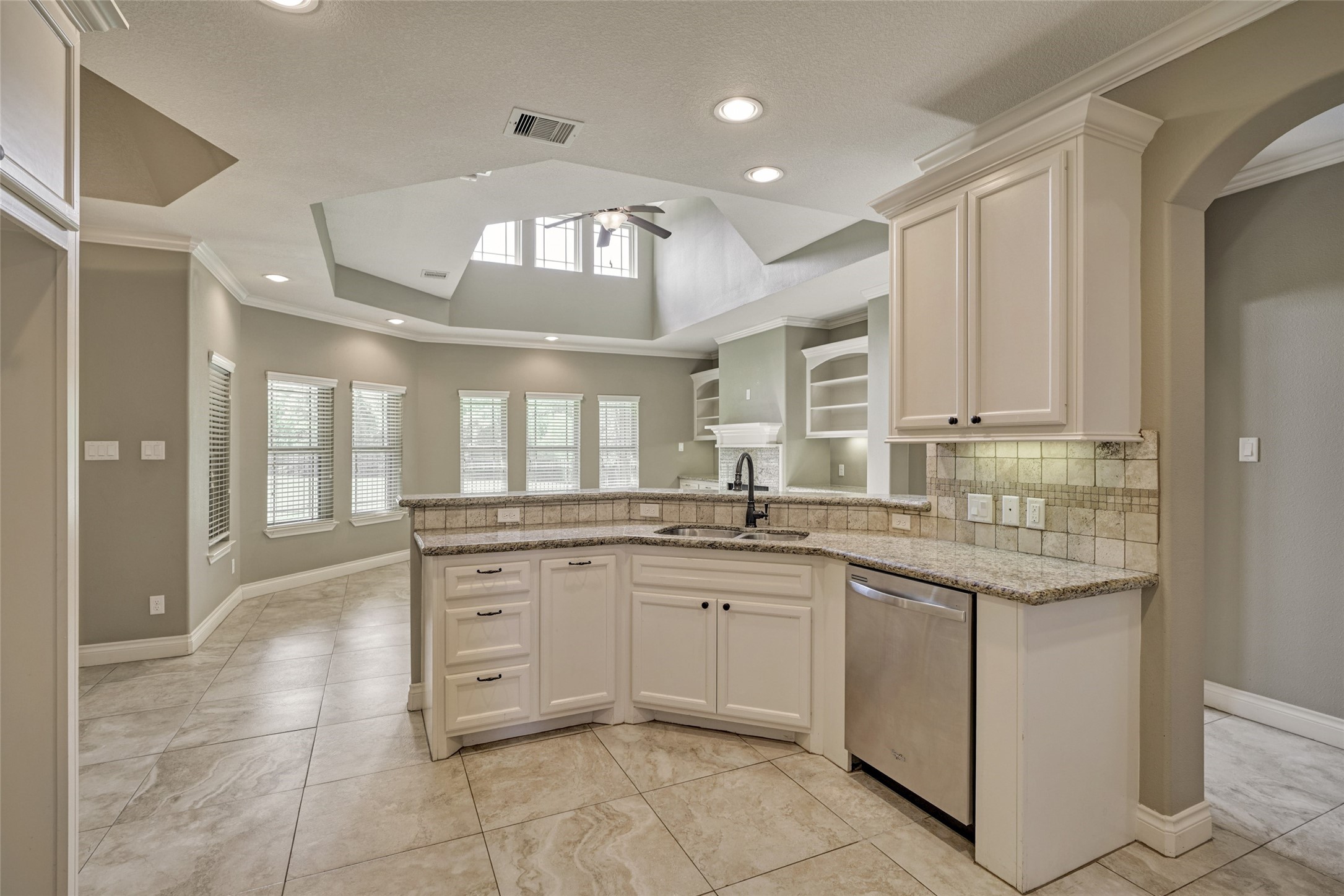Open concept with 2-story living room keep this space light and bright.