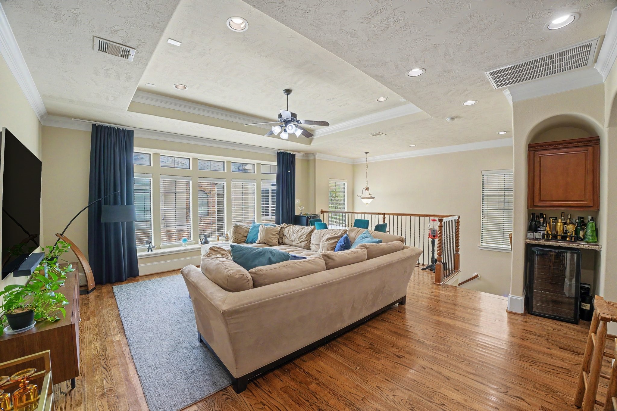 Second floor living with tall ceilings, recessed lighting and gleaming hardwood flooring. Wall of windows make it light and bright Second floor living with tall ceilings, recessed lighting and gleaming hardwood flooring. Wall of windows make it light and bright