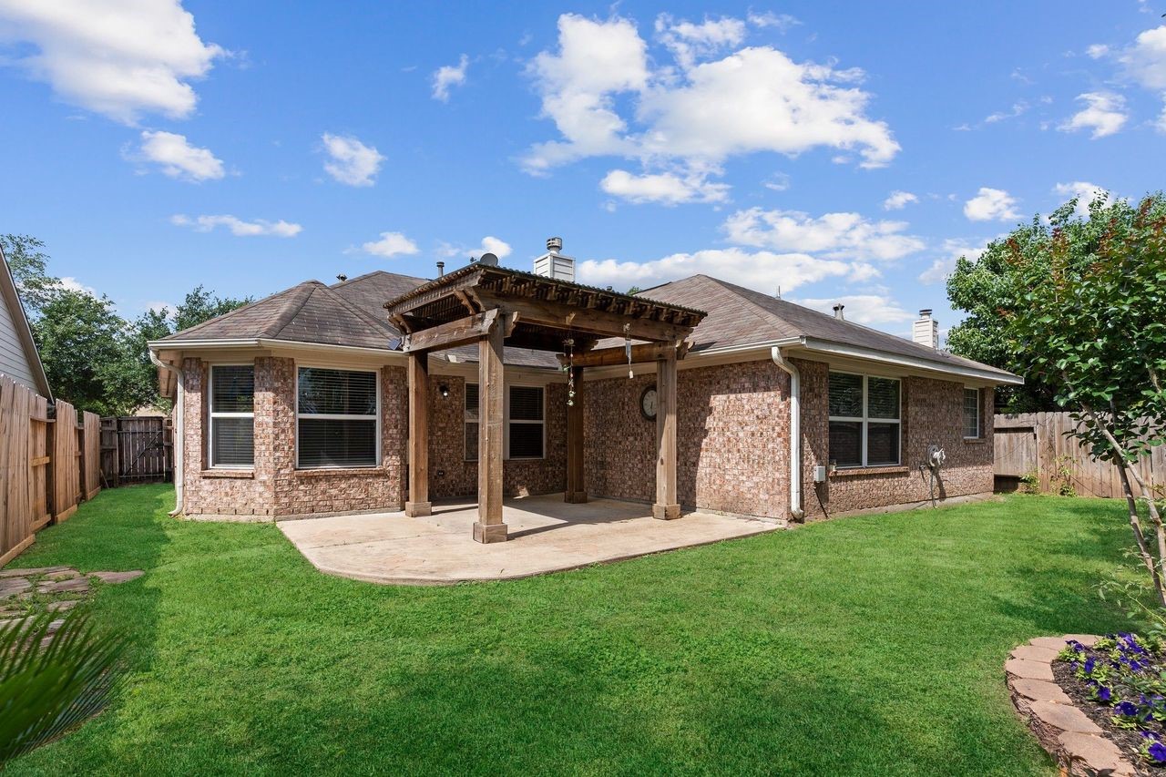 This is all Brick One Story Home with Gutters all around!  Lush Landscaping and amazing Covered Patio!