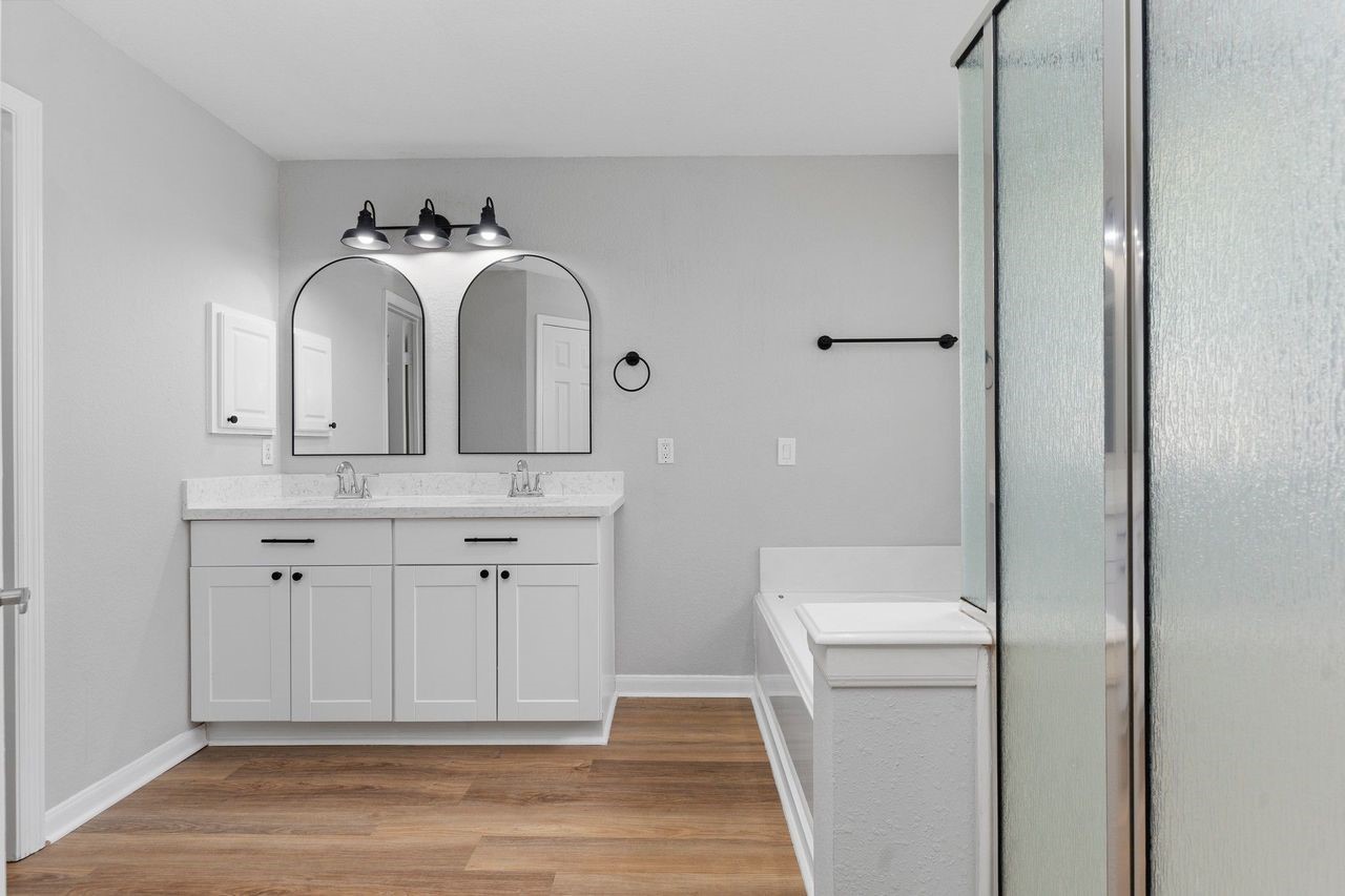 The Spa Like Primary Suite Bathroom just for you!  Features upgrade Custom Vanity with Upgrade Quartz Countertops, Deep two Undermount Sinks, Custom Mirror and more!