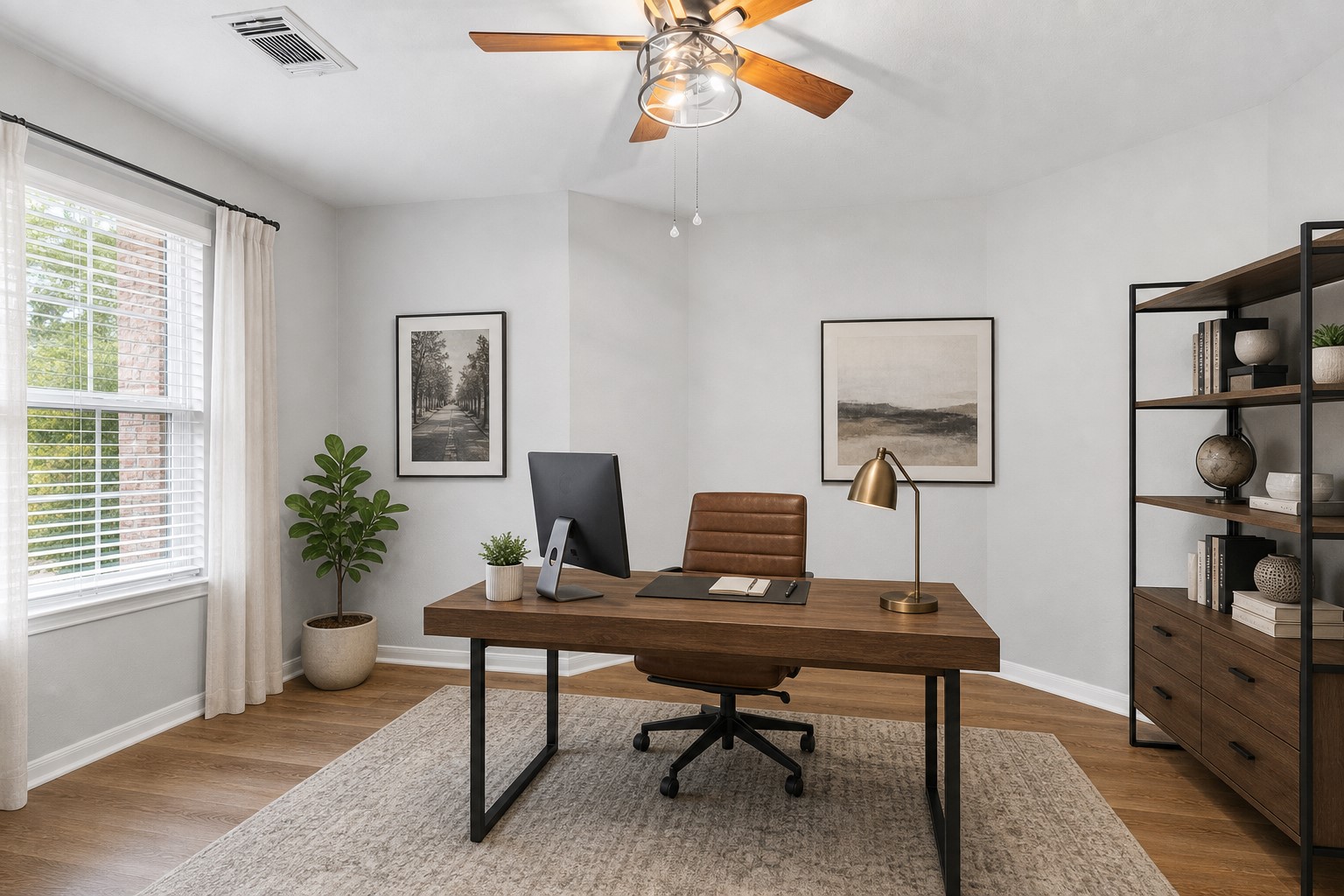 The private home office or study features upgraded carefree luxury vinyl plank flooring, soaring ceilings, and a ceiling fan, creating a comfortable and inviting workspace. Virtually Staged