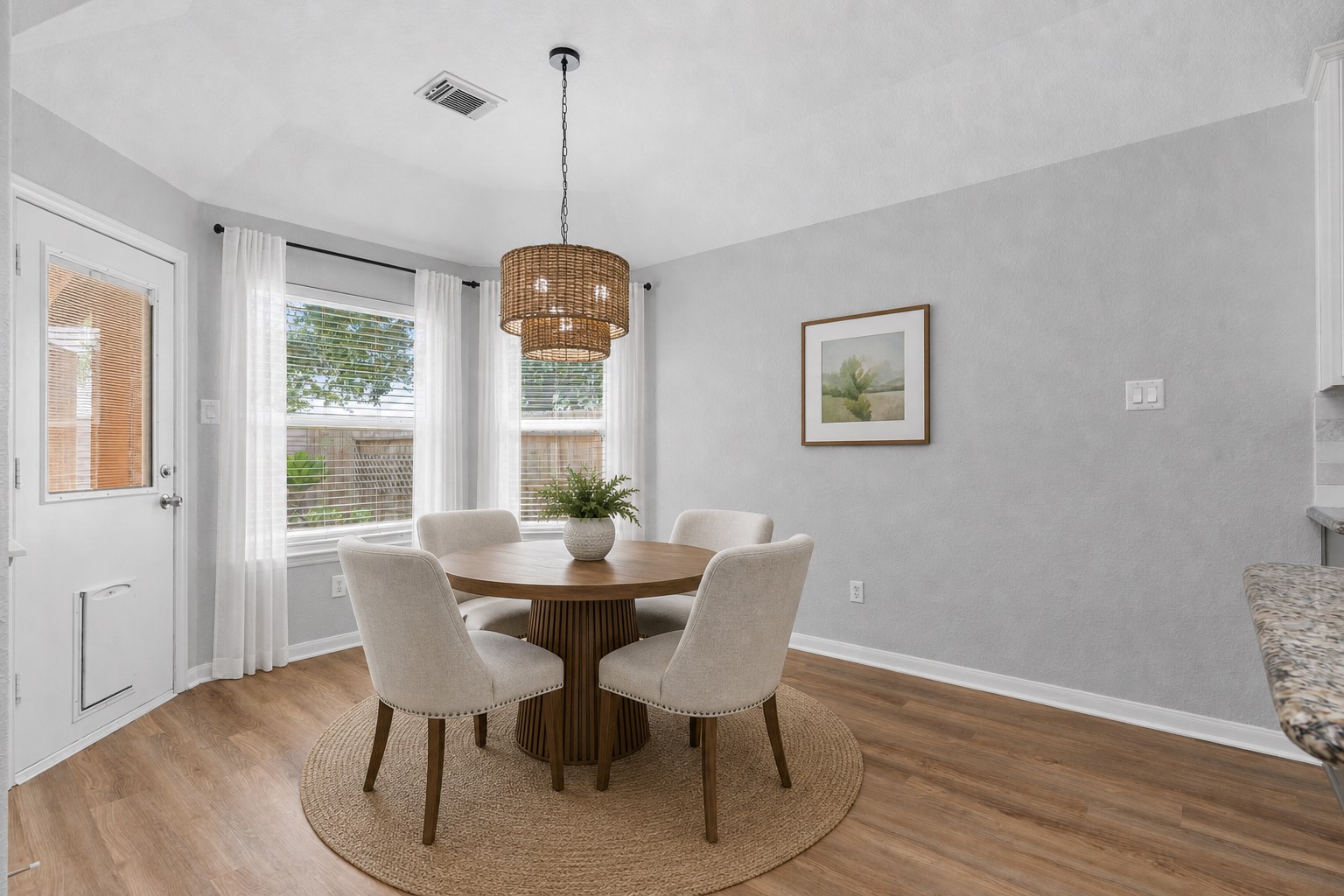 The casual dining area overlooks your private backyard with no rear neighbors, offering peaceful views and the perfect setting for everyday meals or entertaining. Virtually Staged