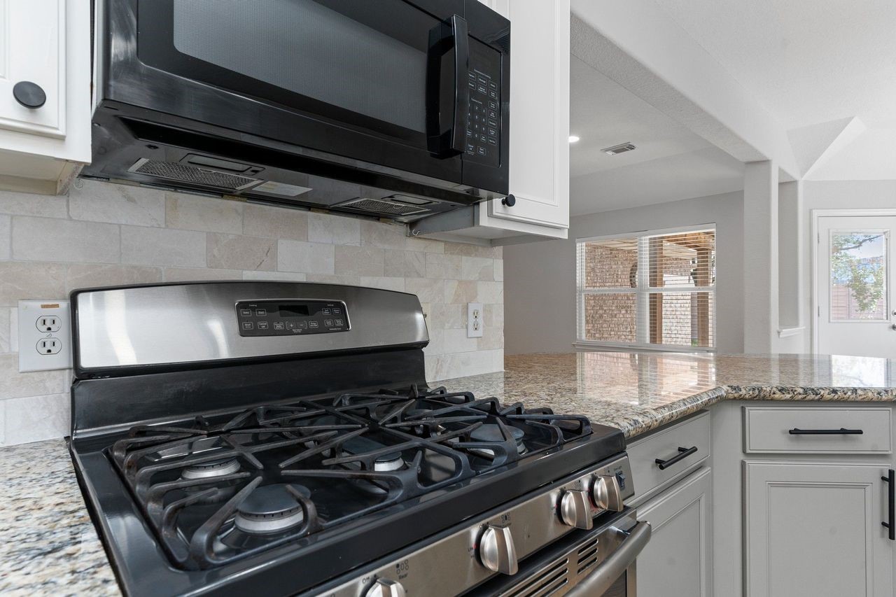 Enjoy cooking with the upgraded Energy Star stainless steel appliances, including a five-burner gas range that's perfect for preparing everyday meals or entertaining family and friends. Style, performance, and energy efficiency come together in this exceptional gourmet kitchen.