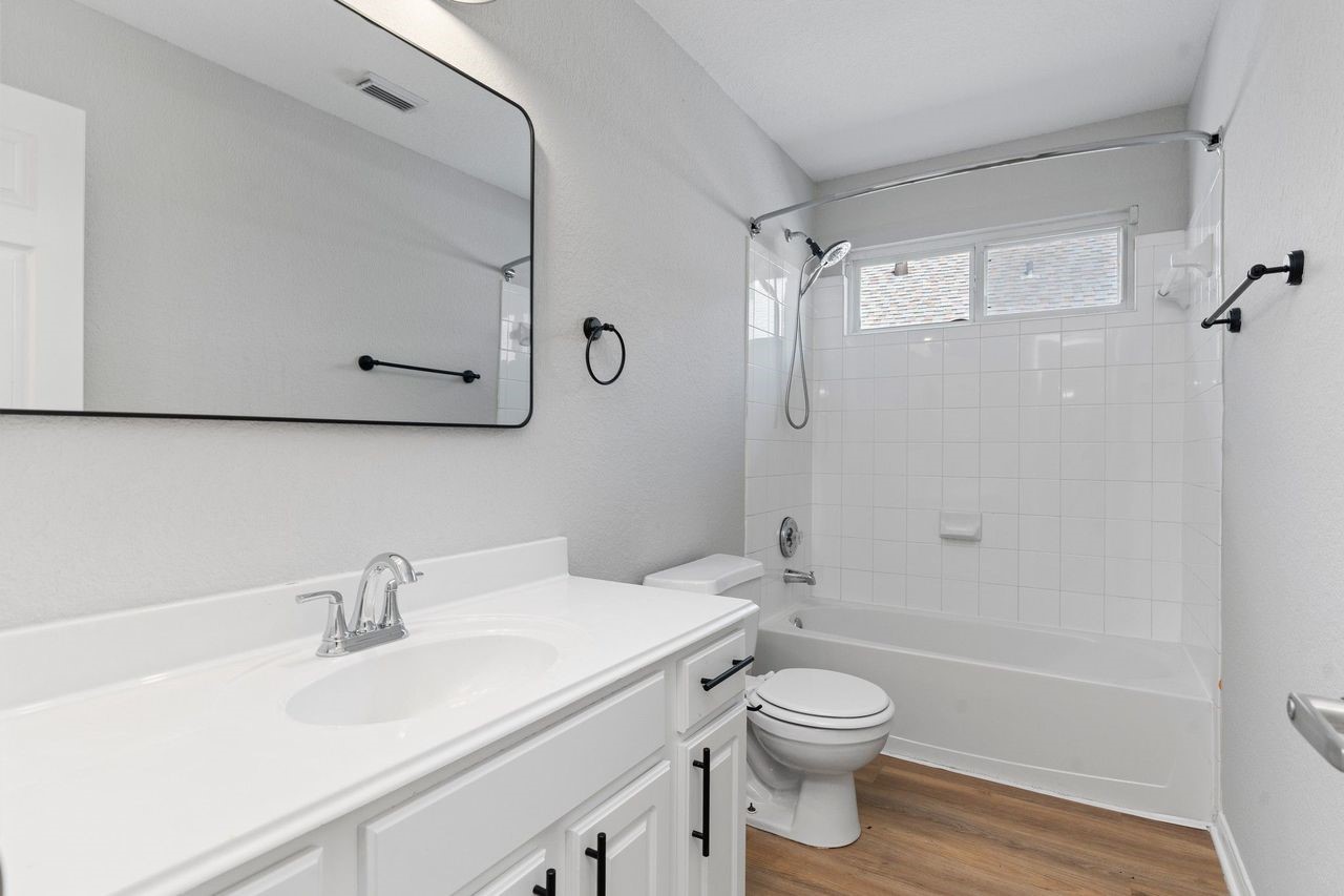 The Guest Bedroom is a delight for any Guest to see! Tub and Shower Combination with Tile Surroudnings and more!