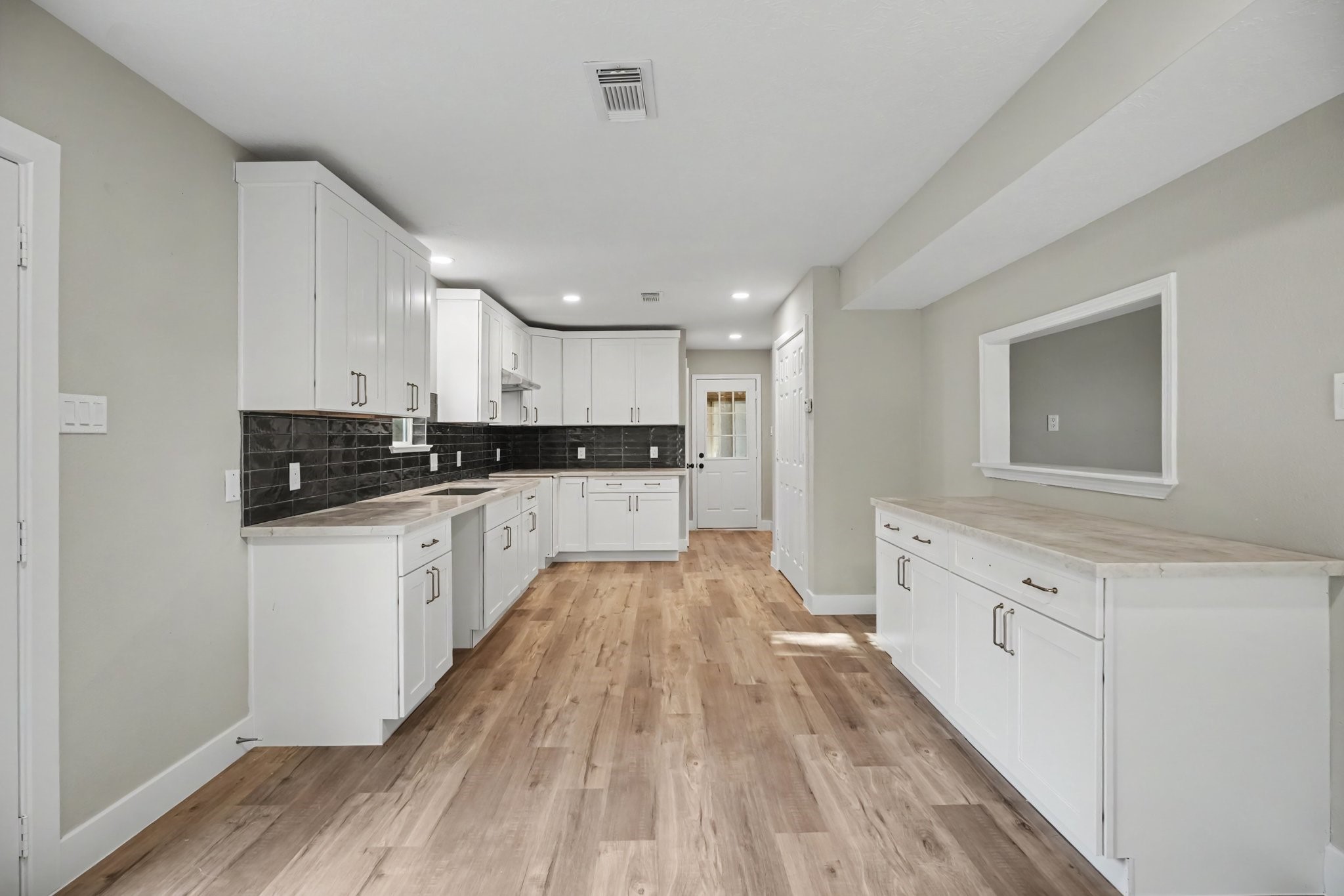 Extra counter space in kitchen with view into living room
