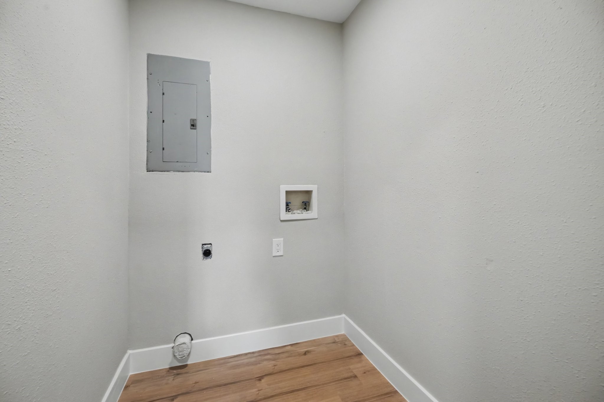 Laundry room downstairs off of kitchen area